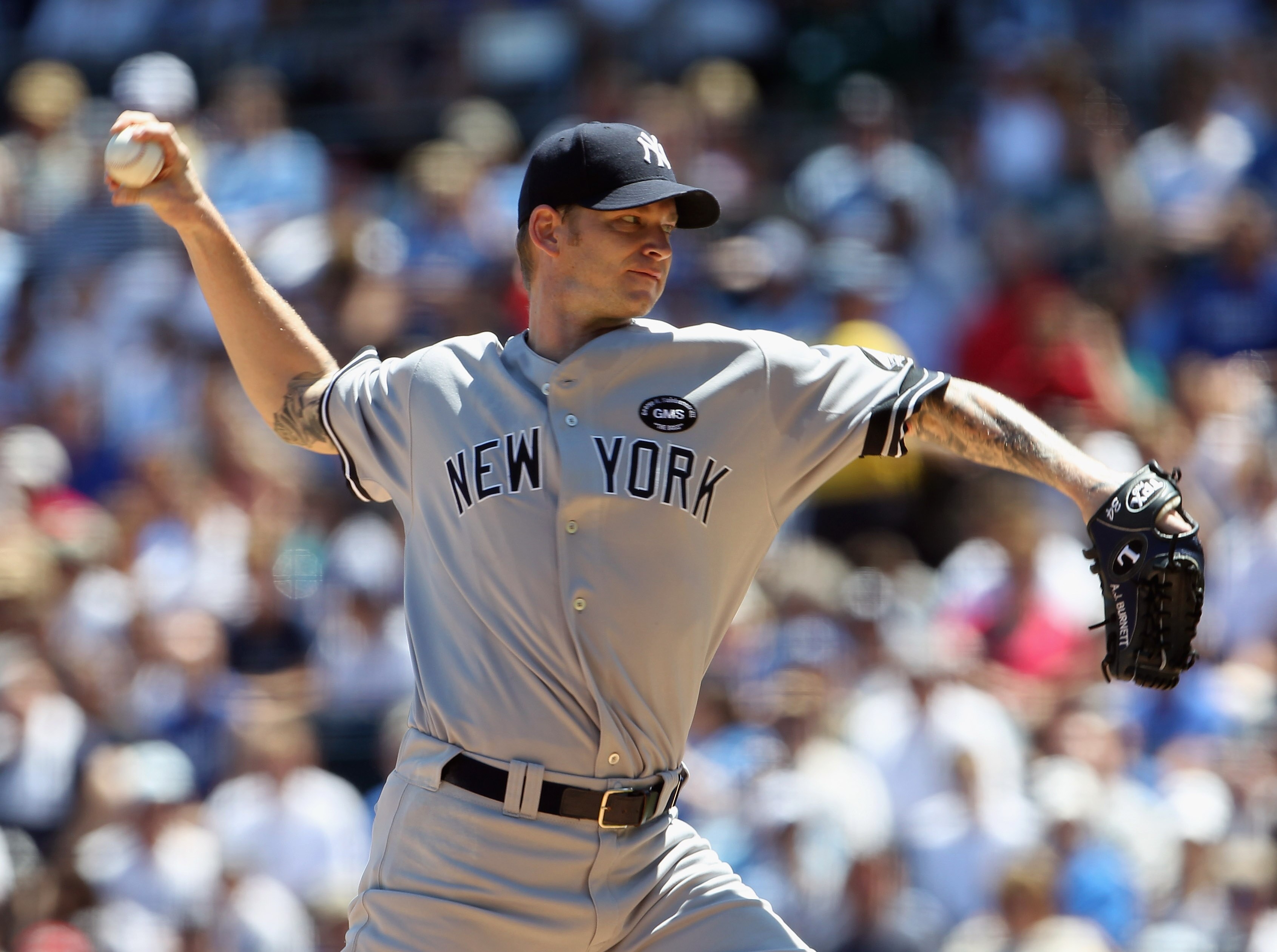 KANSAS CITY, MO - AUGUST 15:  Starting pitcher A.J. Burnett #34 of the New York Yankees pitches during the game against the Kansas City Royals on August 15, 2010 at Kauffman stadium in Kansas City, Missouri.  (Photo by Jamie Squire/Getty Images)