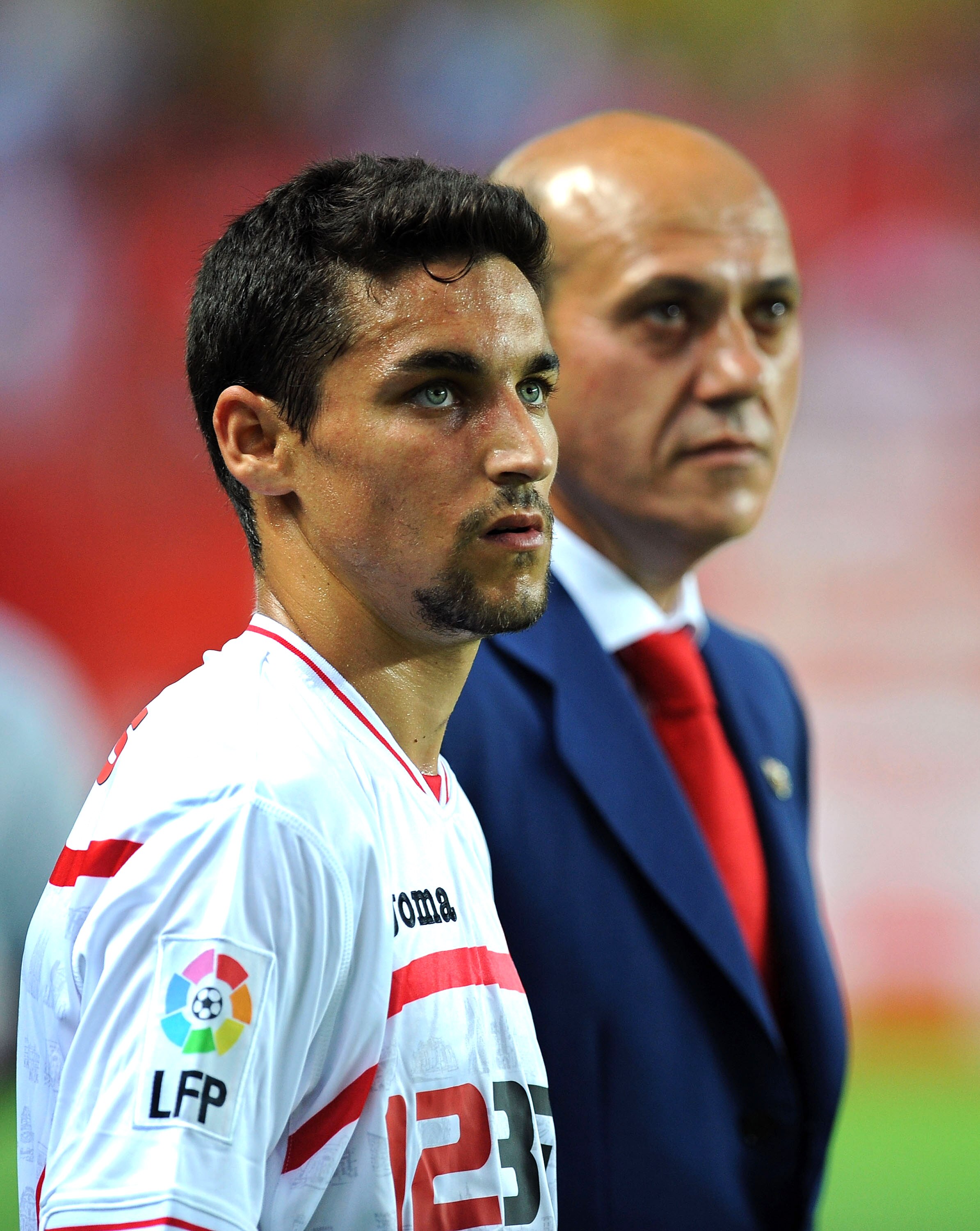 SEVILLE, SPAIN - AUGUST 14:  Jesus Navas (L) of Sevilla stands beside club president Jose Maria del Nido before the Supercopa, first leg, match between Sevilla and Barcelona at the Sanchez Pizjuan stadium  on August 14, 2010 in Seville, Spain.  (Photo by