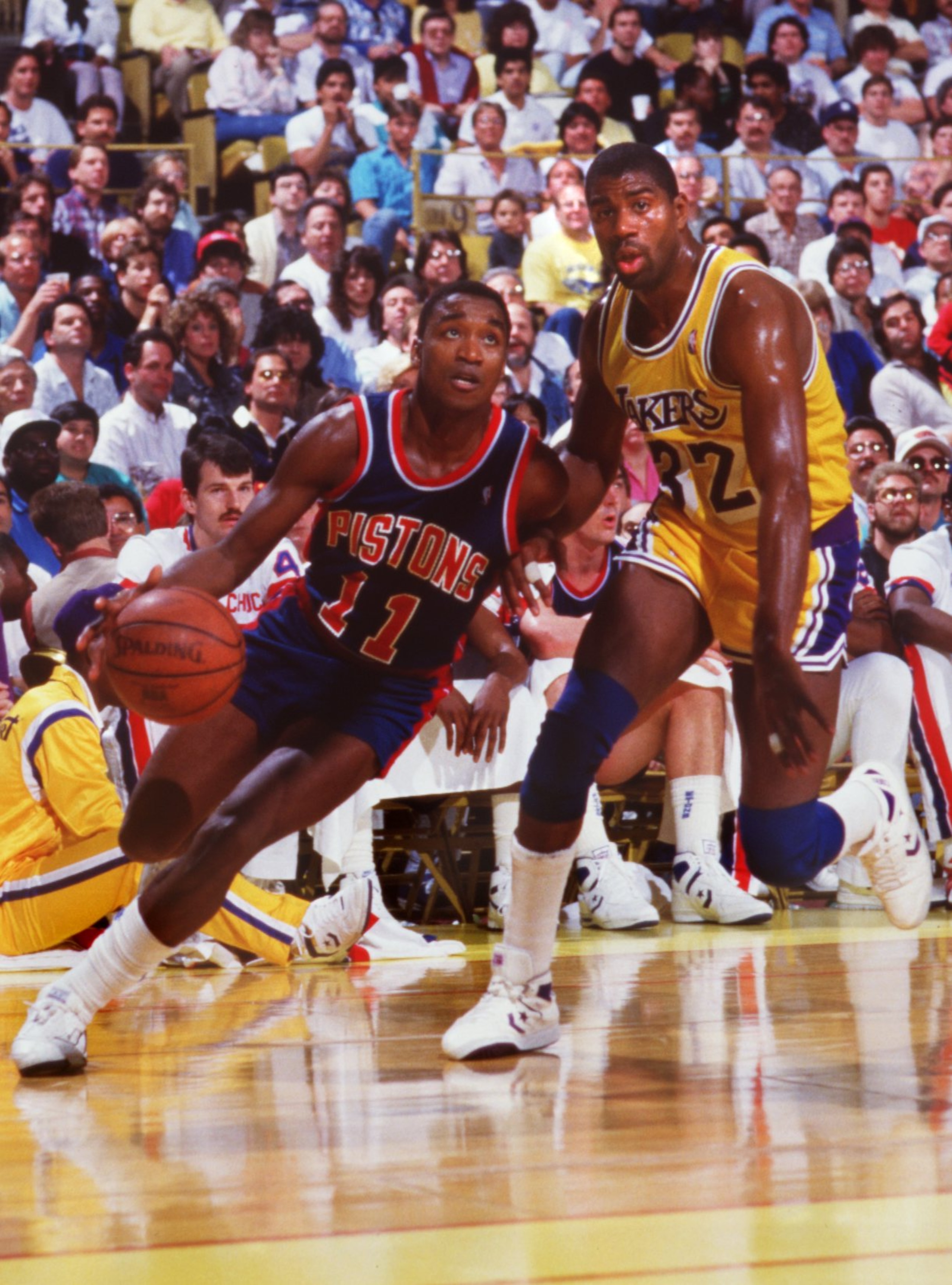 1987:  ISIAH THOMAS OF THE DETROIT PISTONS DRIVES PAST MAGIC JOHNSON OF THE LAKERS. Mandatory Credit: Rick Stewart/ALLSPORT