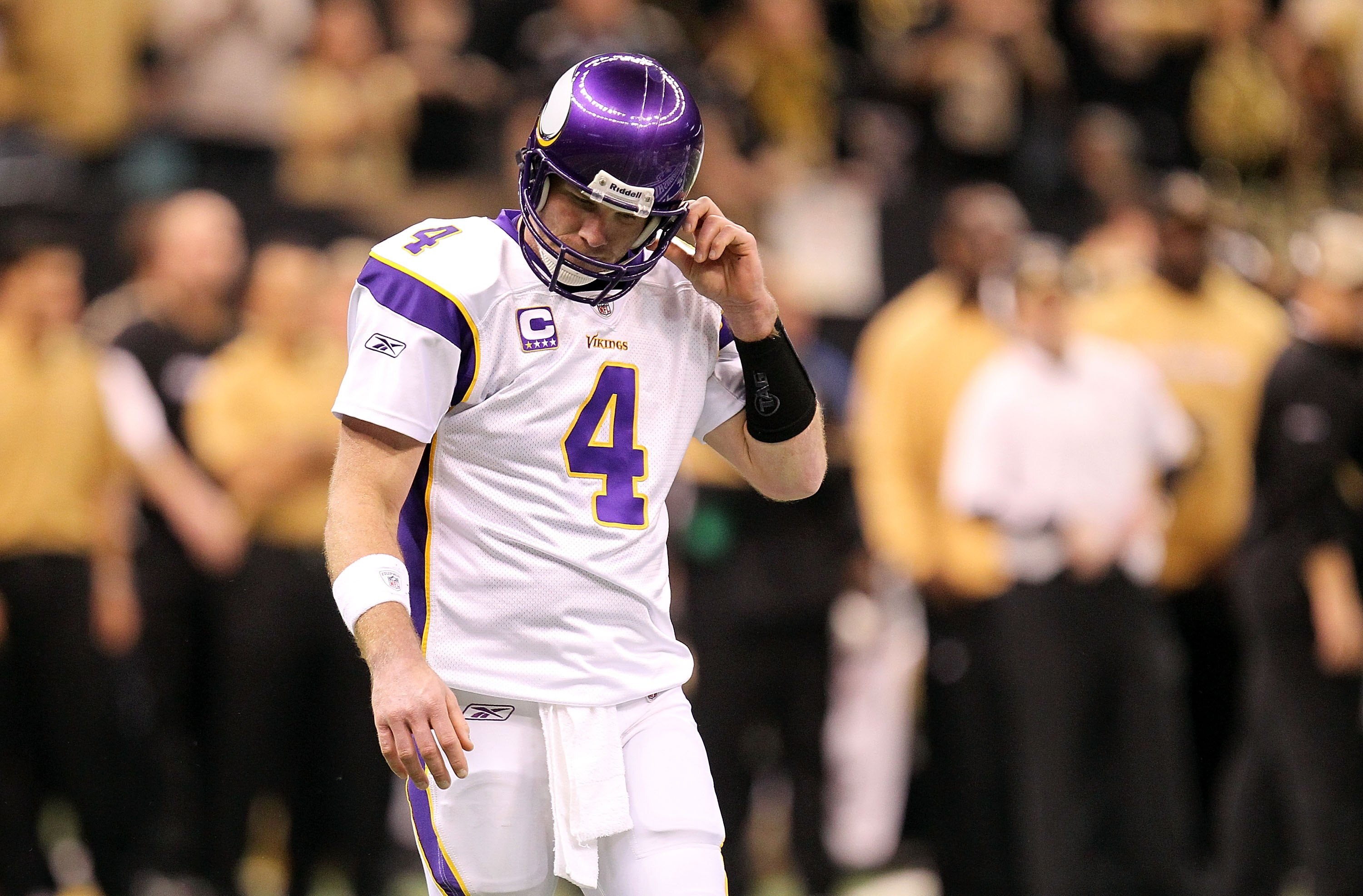 NEW ORLEANS - JANUARY 24:  Brett Favre #4 of the Minnesota Vikings adjusts his helmeti against the New Orleans Saints during the NFC Championship Game at the Louisiana Superdome on January 24, 2010 in New Orleans, Louisiana. The Saints won 31-28 in overti