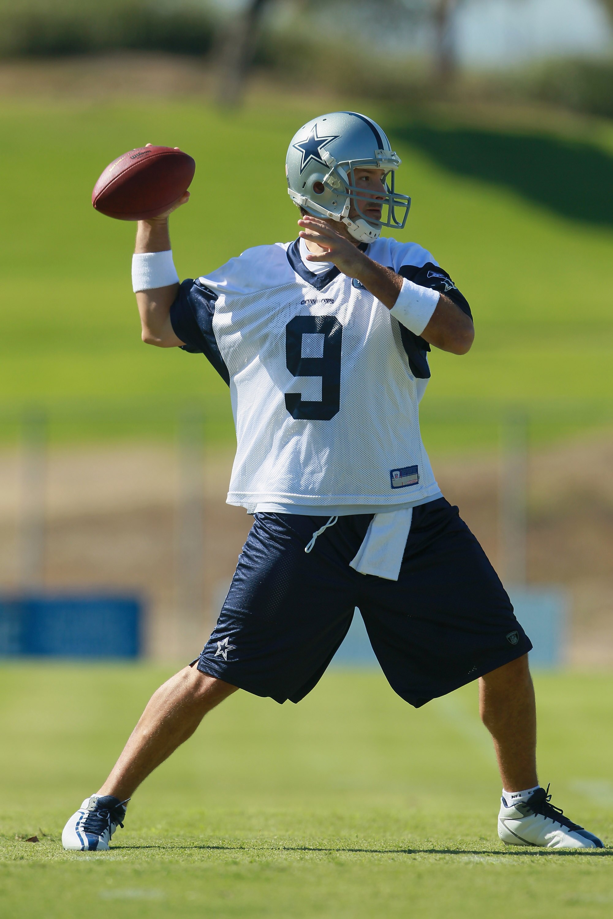 OXNARD, CA - AUGUST 14:  Quarterback Tony Romo #9 drops back to pass during Dallas Cowboys Training Camp at the Marriott Residence Inn Oxnard River Ridge on August 14, 2010 in Oxnard, California.  (Photo by Jeff Gross/Getty Images)