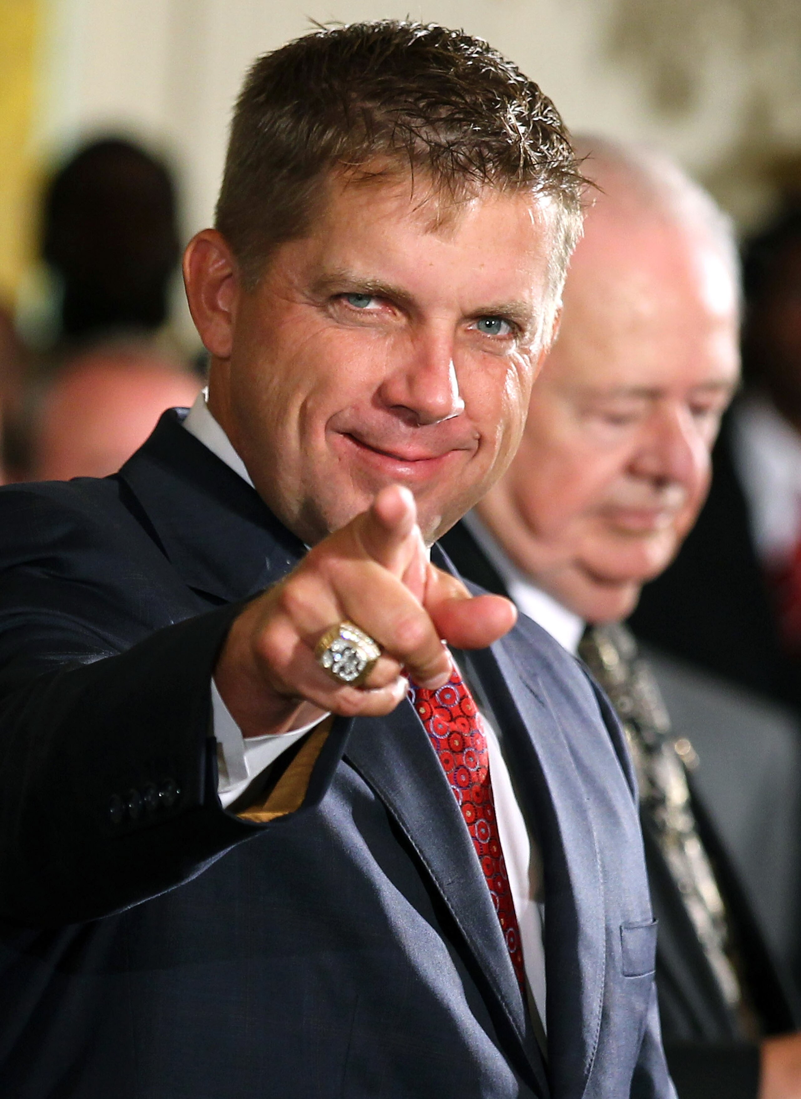 WASHINGTON - AUGUST 09:   Head coach of the New Orleans Saints Sean Payton (L) acknowledges the crowd as he and owner Tom Benson (R) wait for the beginning of a reception for the 2010 National Football League Super Bowl champions in the East Room of the W