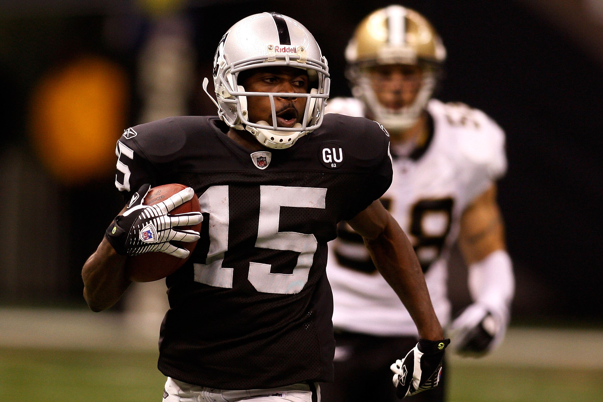 NEW ORLEANS - OCTOBER 12: Johnnie Lee Higgins #15 of the Oakland Raiders runs past Scott Shanle #58 of the New Orleans Saints on October 12, 2008 at the Superdome in New Orleans, Louisiana. (Photo by Chris Graythen/Getty Images) NEW ORLEANS - OCTOBER 12: Johnnie Lee Higgins #15 of the Oakland Raiders runs past Scott Shanle #58 of the New Orleans Saints on October 12, 2008 at the Superdome in New Orleans, Louisiana. (Photo by Chris Graythen/Getty Images)
