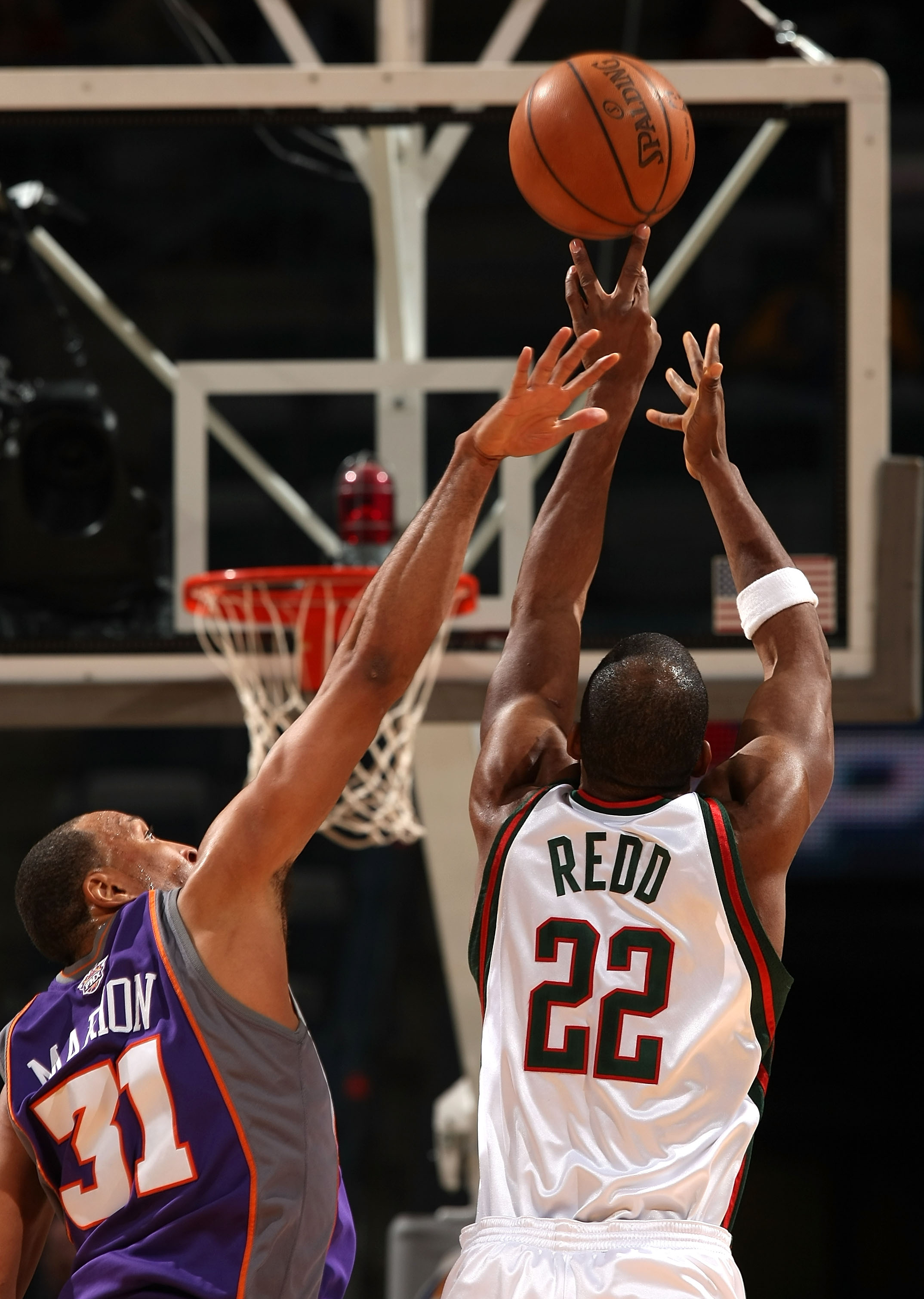 MILWAUKEE - JANUARY 22:  Michael Redd #22 of the Milwaukee Bucks attempts a shot against Shawn Marion #31 of the Phoenix Suns at the Bradley Center on January 22, 2008 in Milwaukee, Wisconsin.  NOTE TO USER: User expressly acknowledges and agrees that, by