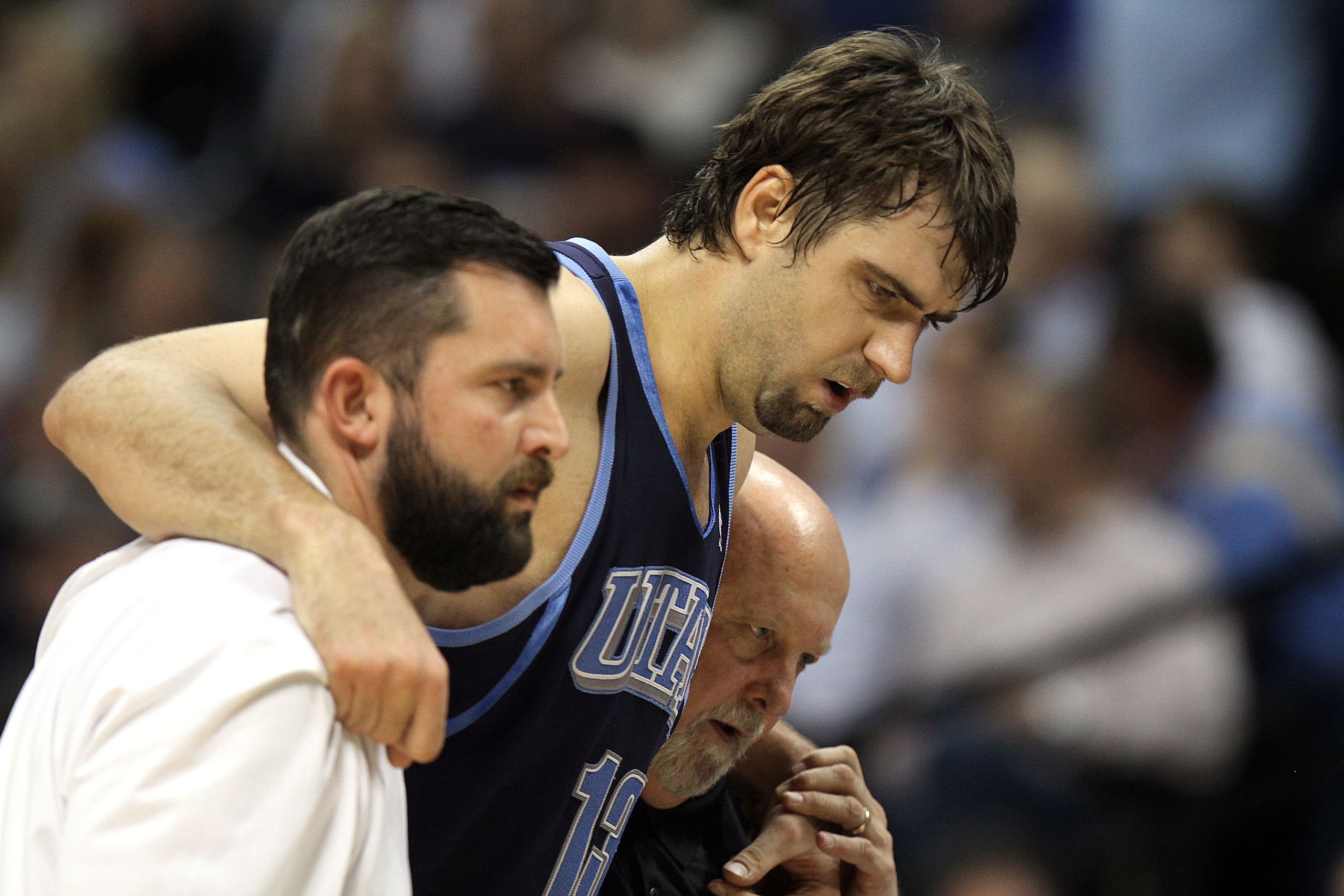 DENVER, CO - APRIL 17 : Mehmet Okur #13 of the Utah Jazz is helped off the court by trainers after twisitng an ankle during the first half of Game One of the Western Conference Quarterfinals of the 2010 NBA Playoffs at the Pepsi Center on April 17, 2010 i DENVER, CO - APRIL 17 : Mehmet Okur #13 of the Utah Jazz is helped off the court by trainers after twisitng an ankle during the first half of Game One of the Western Conference Quarterfinals of the 2010 NBA Playoffs at the Pepsi Center on April 17, 2010 i