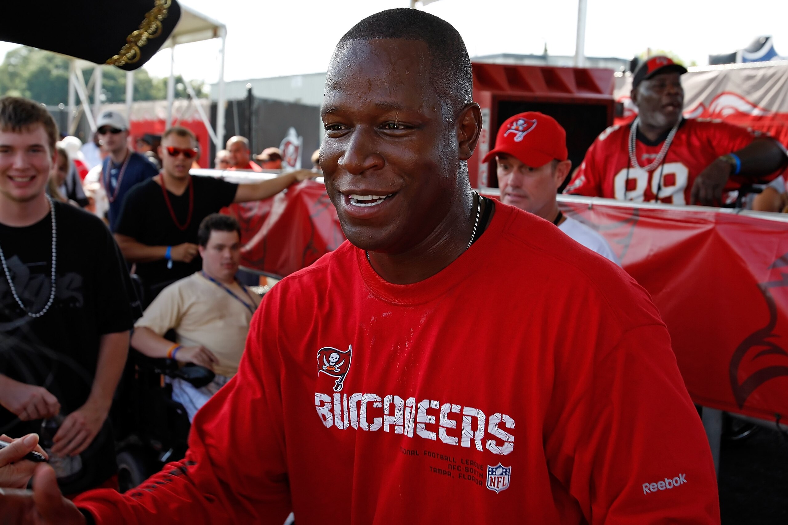TAMPA - JULY 31: Head coach Raheem Morris of the Tampa Bay Buccaneers signs some autographs during training camp at One Buccaneer Place on July 31, 2010 in Tampa, Florida. (Photo by J. Meric/Getty Images) TAMPA - JULY 31: Head coach Raheem Morris of the Tampa Bay Buccaneers signs some autographs during training camp at One Buccaneer Place on July 31, 2010 in Tampa, Florida. (Photo by J. Meric/Getty Images)