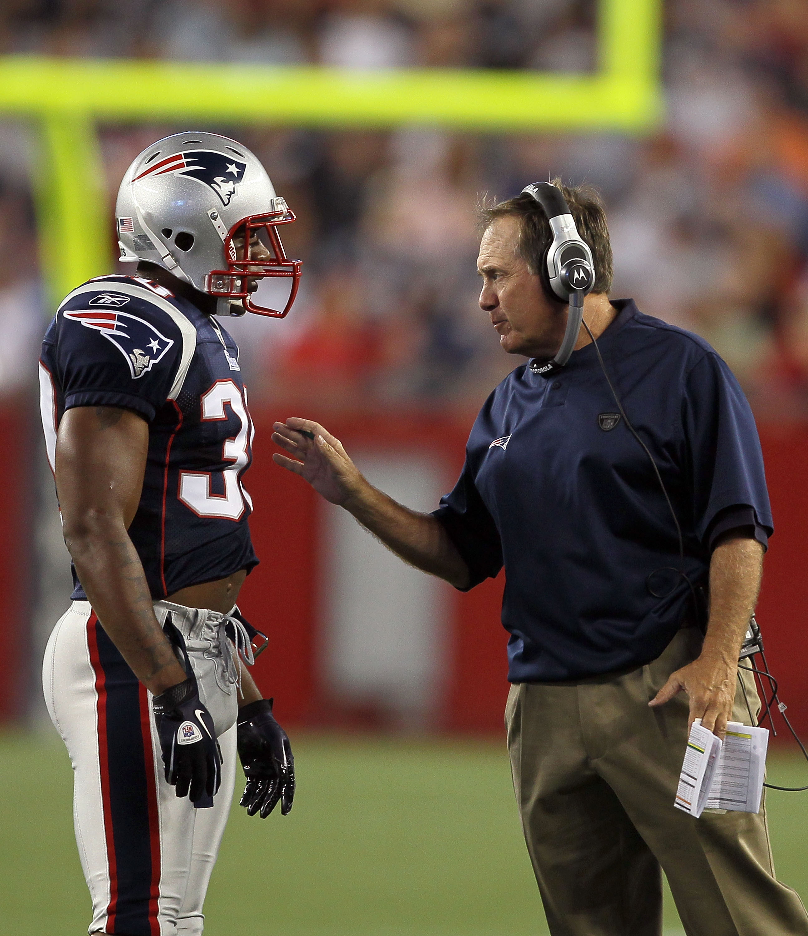 FOXBORO, MA - AUGUST 12: Brandon McGowan # 30 and Coach Bill Belichick of the New England Patriots talk during the preseason game against the New Orleans Saints at Gillette Stadium on August 12, 2010 in Foxboro, Massachusetts. (Photo by Jim Rogash/Getty I