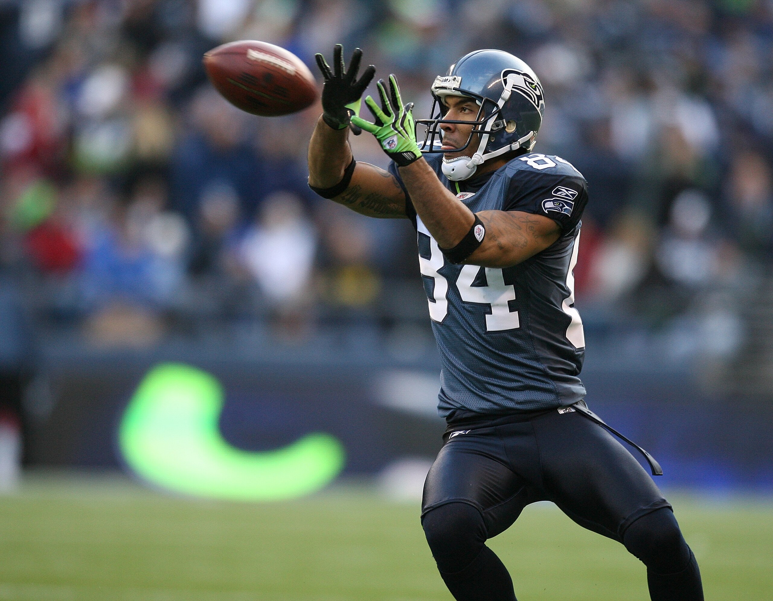 SEATTLE - DECEMBER 06:  Wide receiver T.J. Houshmandzadeh #84 of the Seattle Seahawks makes a catch against the San Francisco 49ers on December 6, 2009 at Qwest Field in Seattle, Washington. (Photo by Otto Greule Jr/Getty Images)