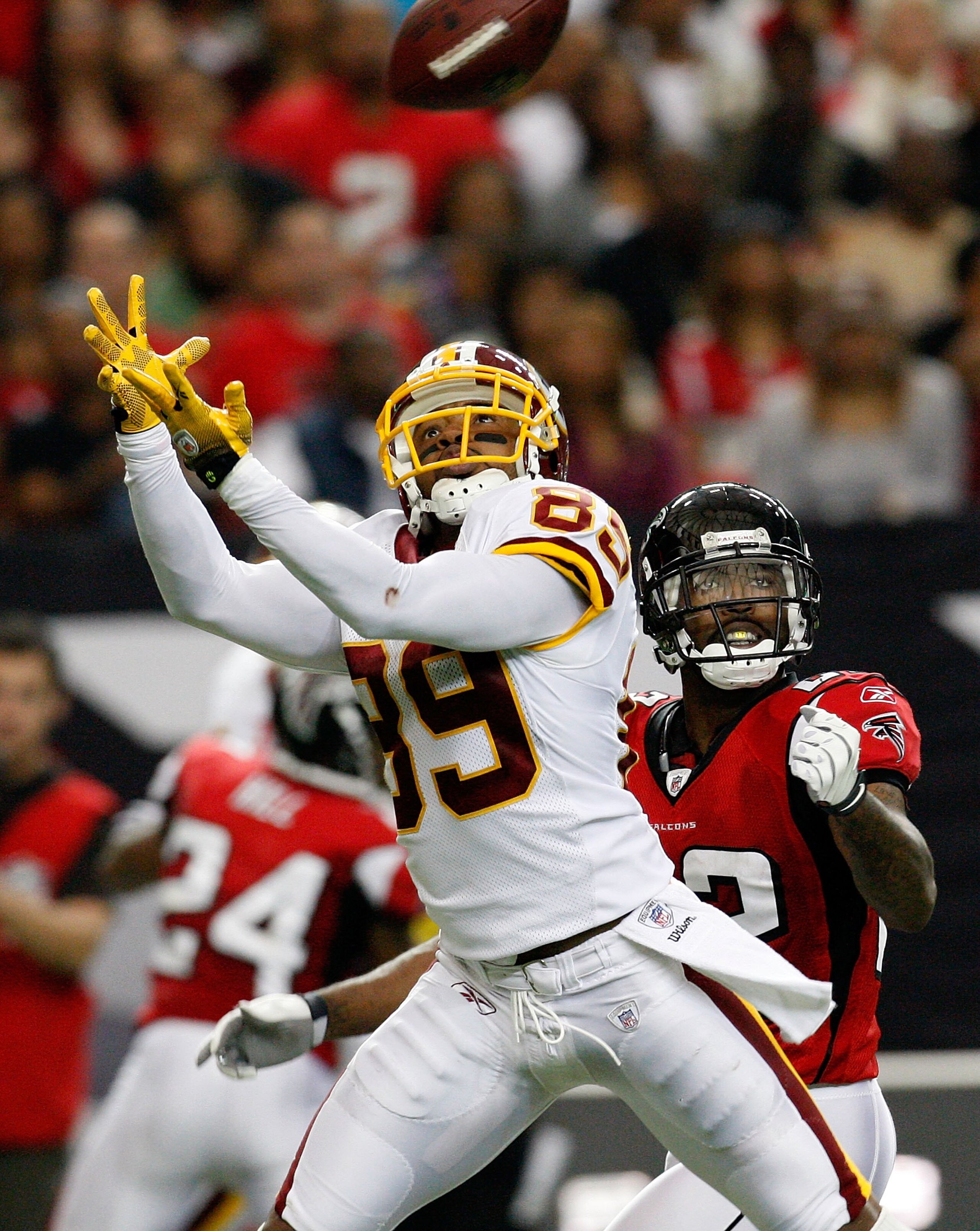 ATLANTA - NOVEMBER 08:  Chevis Jackson #22 of the Atlanta Falcons defends a pass intended for Santana Moss #89 of the Washington Redskins at Georgia Dome on November 8, 2009 in Atlanta, Georgia.  (Photo by Kevin C. Cox/Getty Images)