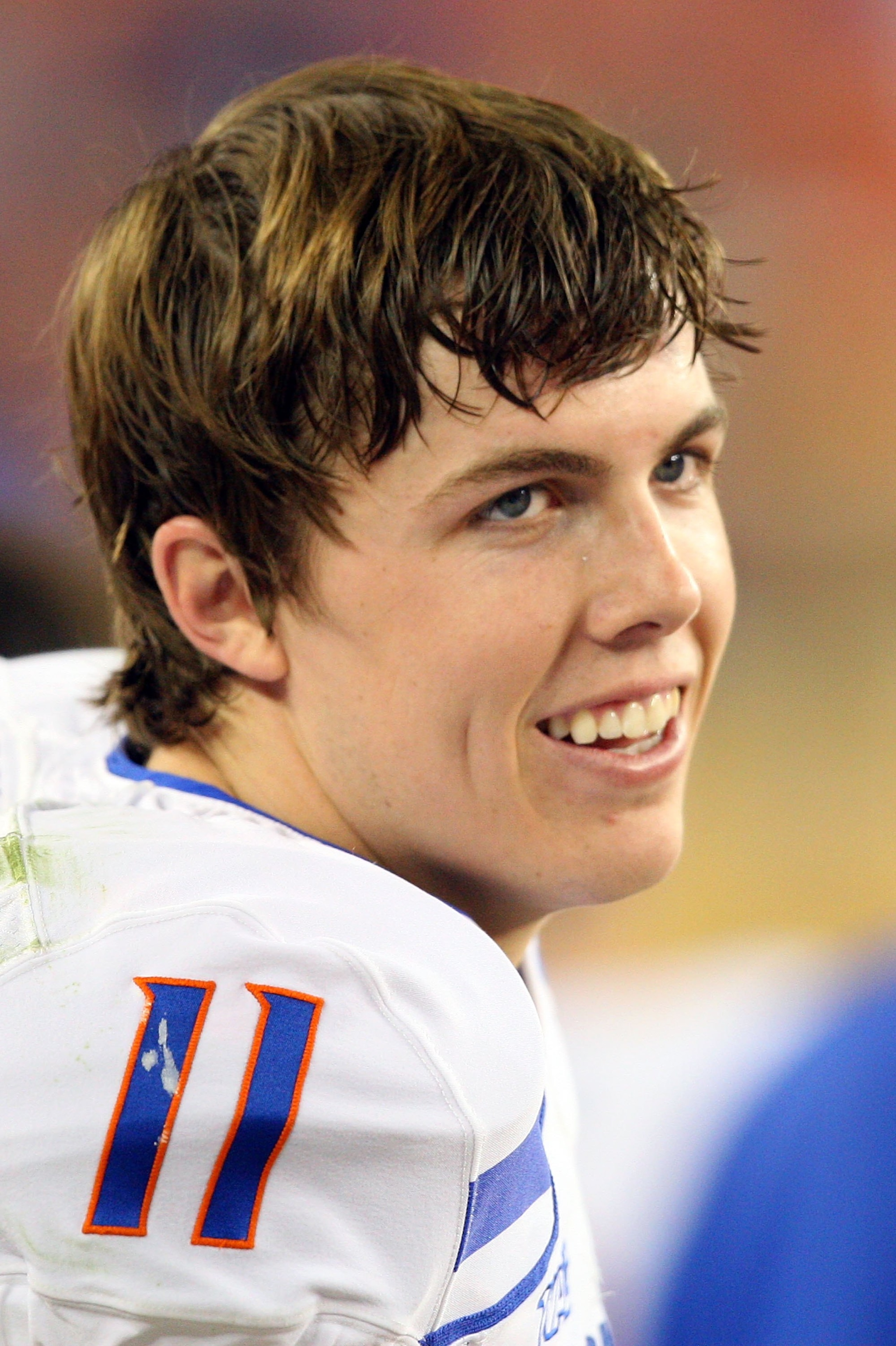 GLENDALE, AZ - JANUARY 04:  Quarterback Kellen Moore #11 of the Boise State Broncos smiles on the sideline in the second half against the TCU Horned Frogs during the Tostitos Fiesta Bowl at the Universtity of Phoenix Stadium on January 4, 2010 in Glendale