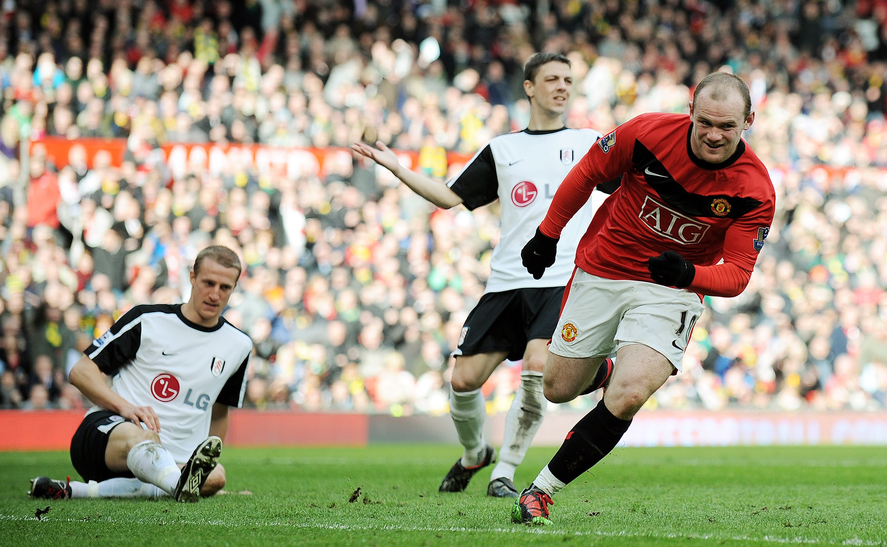 MANCHESTER, ENGLAND - MARCH 14:  Wayne Rooney of Manchester United celebrates scoring the first goal during the Barclays Premier League match between Manchester United and Fulham at Old Trafford on March 14, 2010 in Manchester, England.  (Photo by Michael