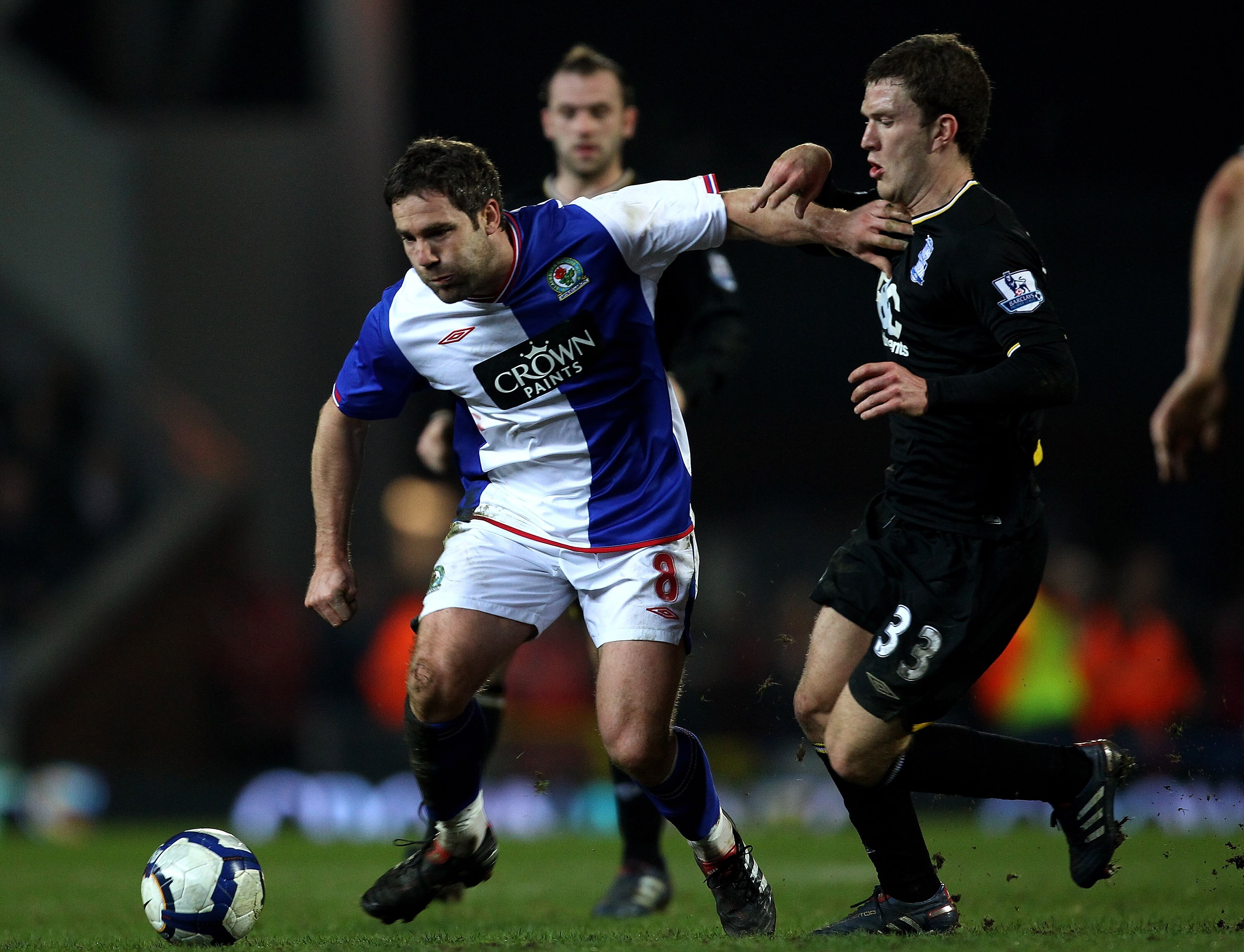 BLACKBURN, ENGLAND - MARCH 24:  David Dunn of Blackburn Rovers holds off the challenge of Craig Gardner of Birmingham City during the Barclays Premier League match between Blackburn Rovers and Birmingham City at Ewood Park on March 24, 2010 in Blackburn,