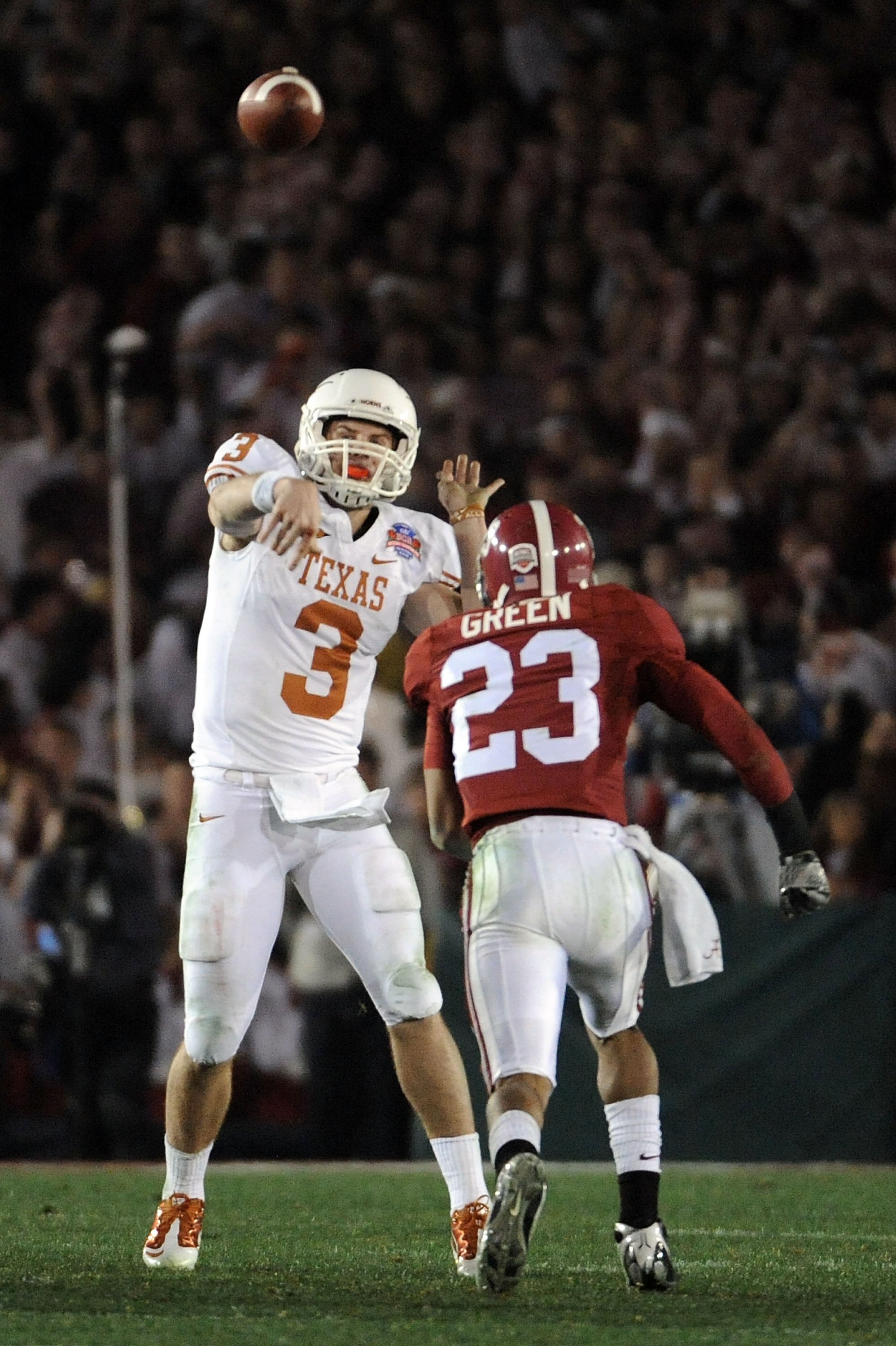 PASADENA, CA - JANUARY 07:  Quarterback Garrett Gilbert #3 of the Texas Longhorns drops back to pass against the Alabama Crimson Tide during the Citi BCS National Championship game at the Rose Bowl on January 7, 2010 in Pasadena, California.  (Photo by Ha