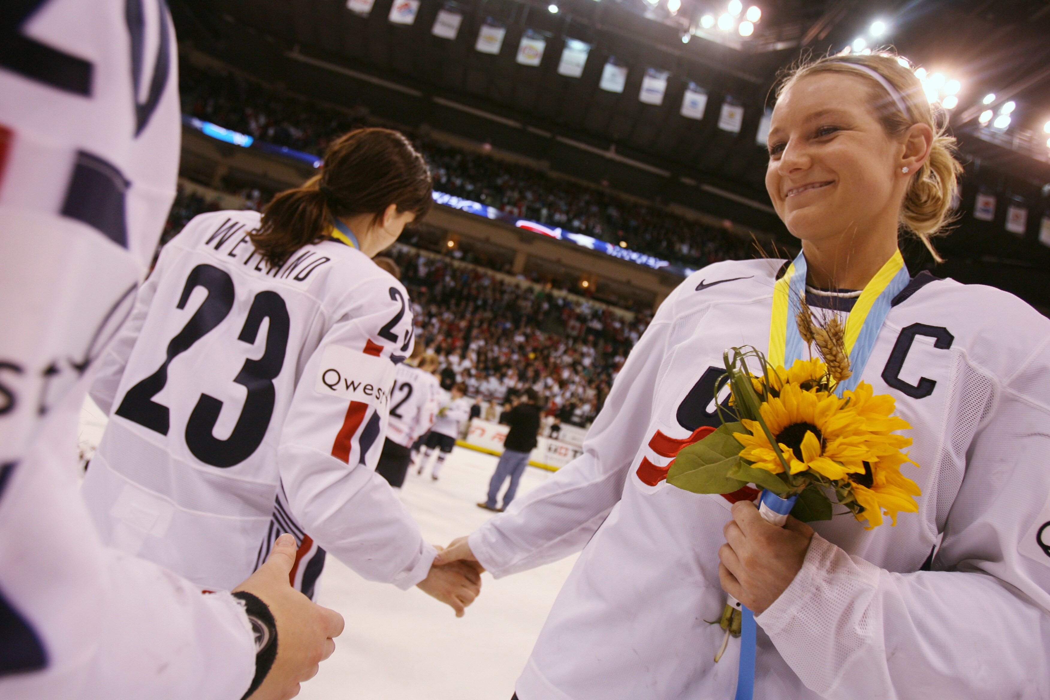 WINNIPEG, CANADA - APRIL 10:  Krissy Wendell #7 of the USA congratulates her team members after losing to Canada 5-1 to claim the silver medal at the IIHF Women's World Championship Gold Medal game at MTS Centre on April 10, 2007 in Winnipeg, Canada.  (Ph