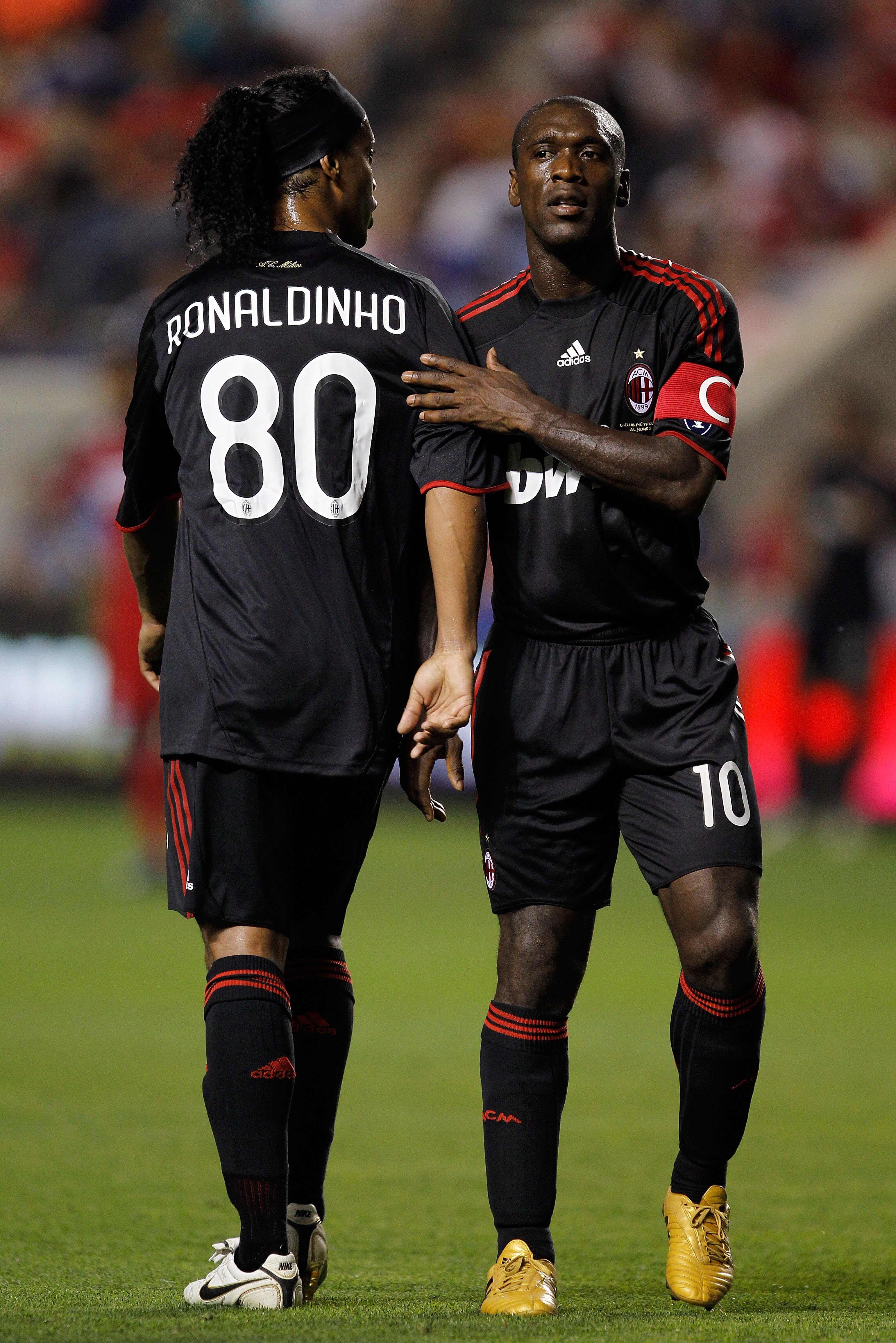 CHICAGO - MAY 30:  Clarence Seedorf #10 and Ronaldinho #80 of AC Milan greet each other as Ronaldinho is taken out of the match in the second half while taking on the Chicago Fire during an international friendly at Toyota Park on May 30, 2010 in Chicago,