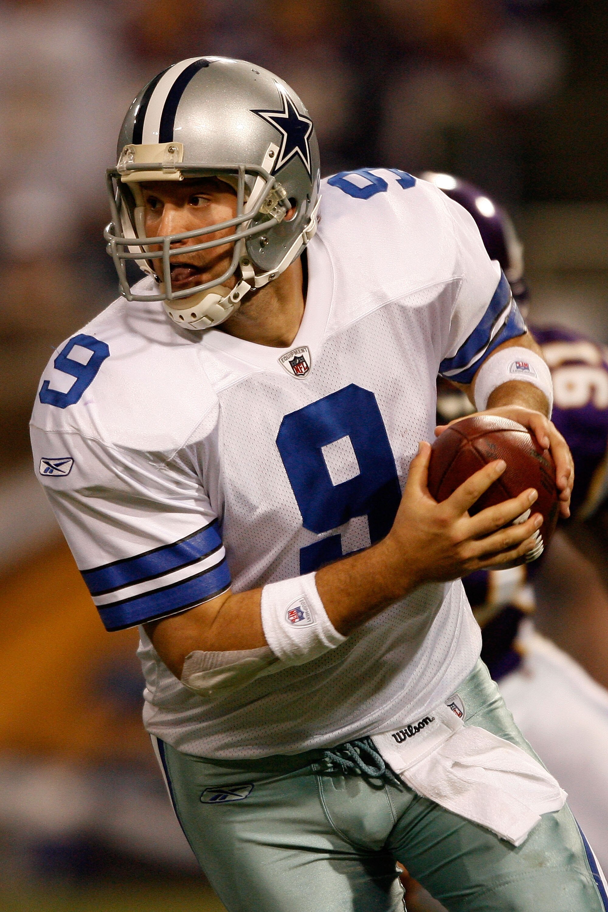 MINNEAPOLIS - JANUARY 17:  Tony Romo #9 of the Dallas Cowboys runs the ball against the Minnesota Vikings during the second quarter of the NFC Divisional Playoff Game at Hubert H. Humphrey Metrodome on January 17, 2010 in Minneapolis, Minnesota.  (Photo b