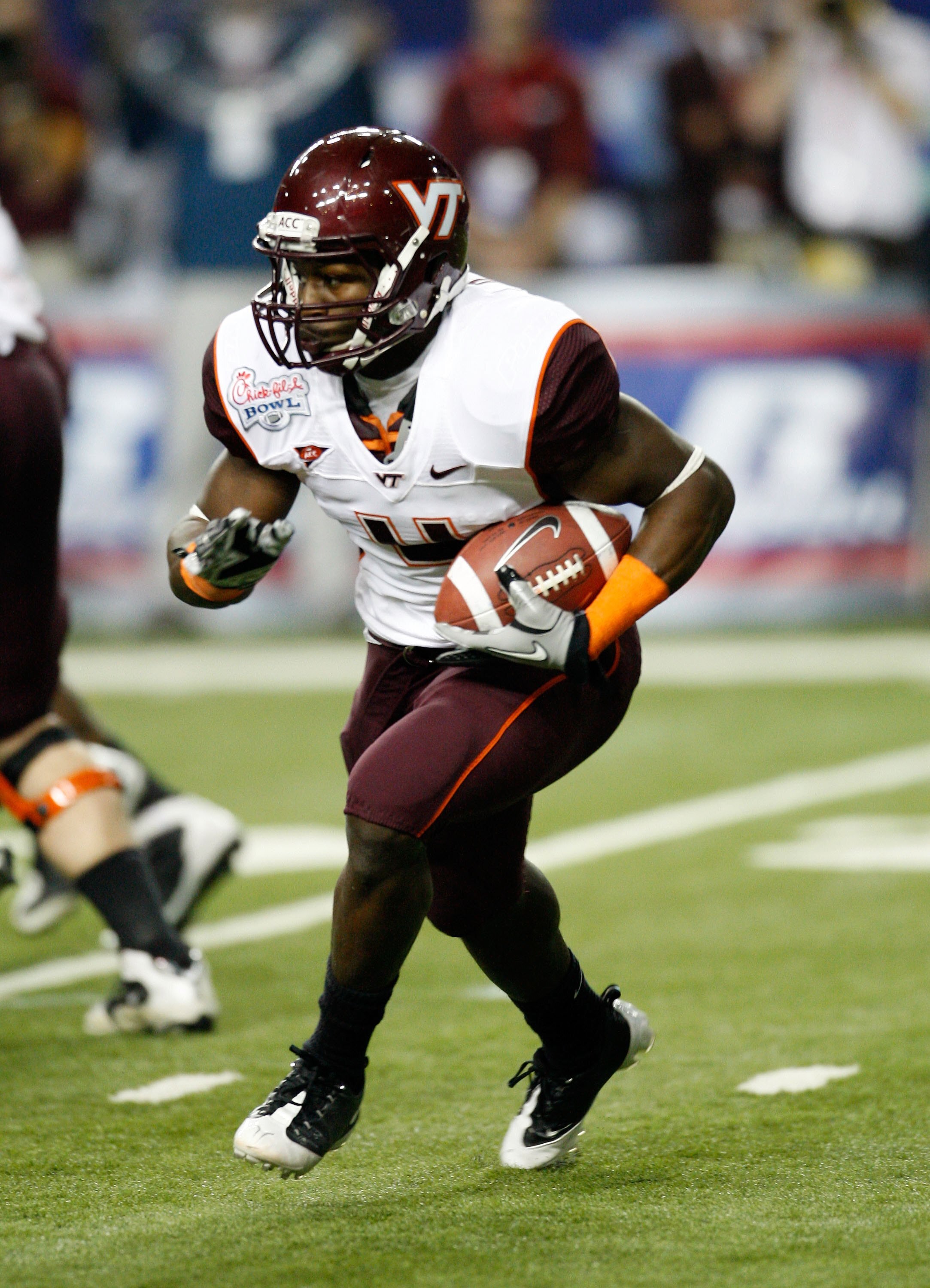 ATLANTA - DECEMBER 31:  Tailgate David Wilson #4 of the Virginia Tech Hokies runs with the ball during the Chick-fil-A Bowl against the Tennessee Volunteers at the Georgia Dome on December 31, 2009 in Atlanta, Georgia.  Virginia Tech beat Tennessee 37-14.
