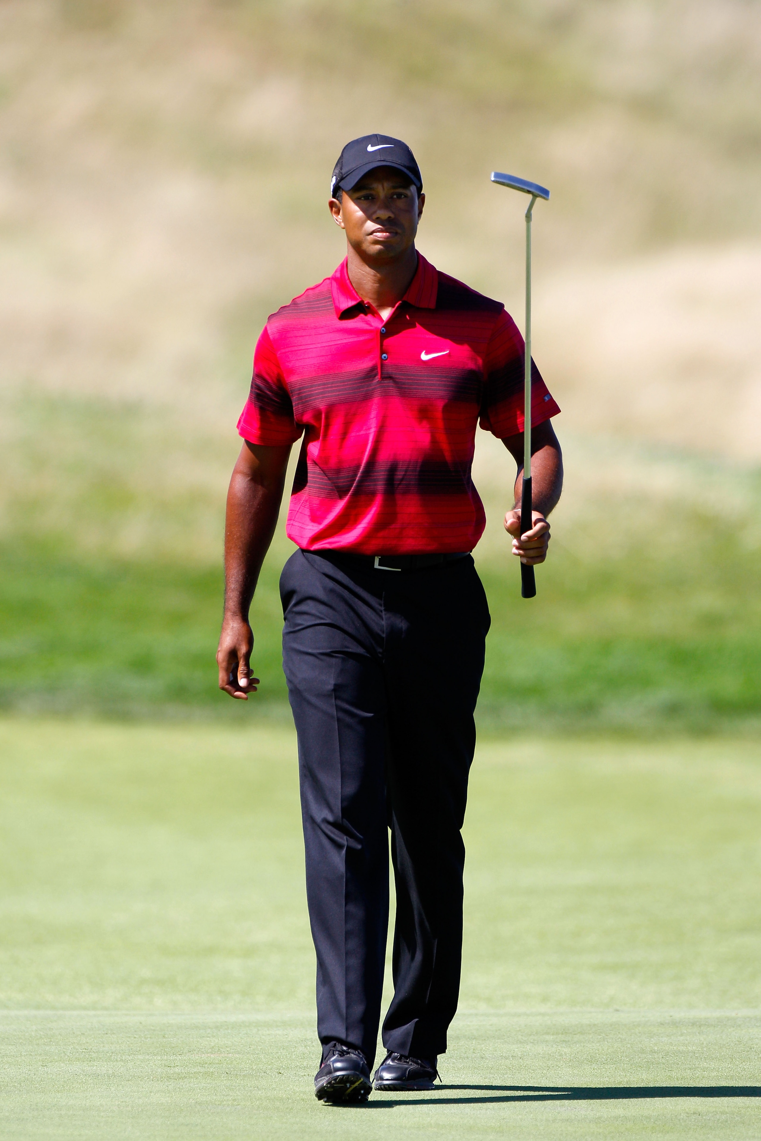KOHLER, WI - AUGUST 15:  Tiger Woods watches his putt on the 17th hole during the final round of the 92nd PGA Championship on the Straits Course at Whistling Straits on August 15, 2010 in Kohler, Wisconsin.  (Photo by Sam Greenwood/Getty Images)