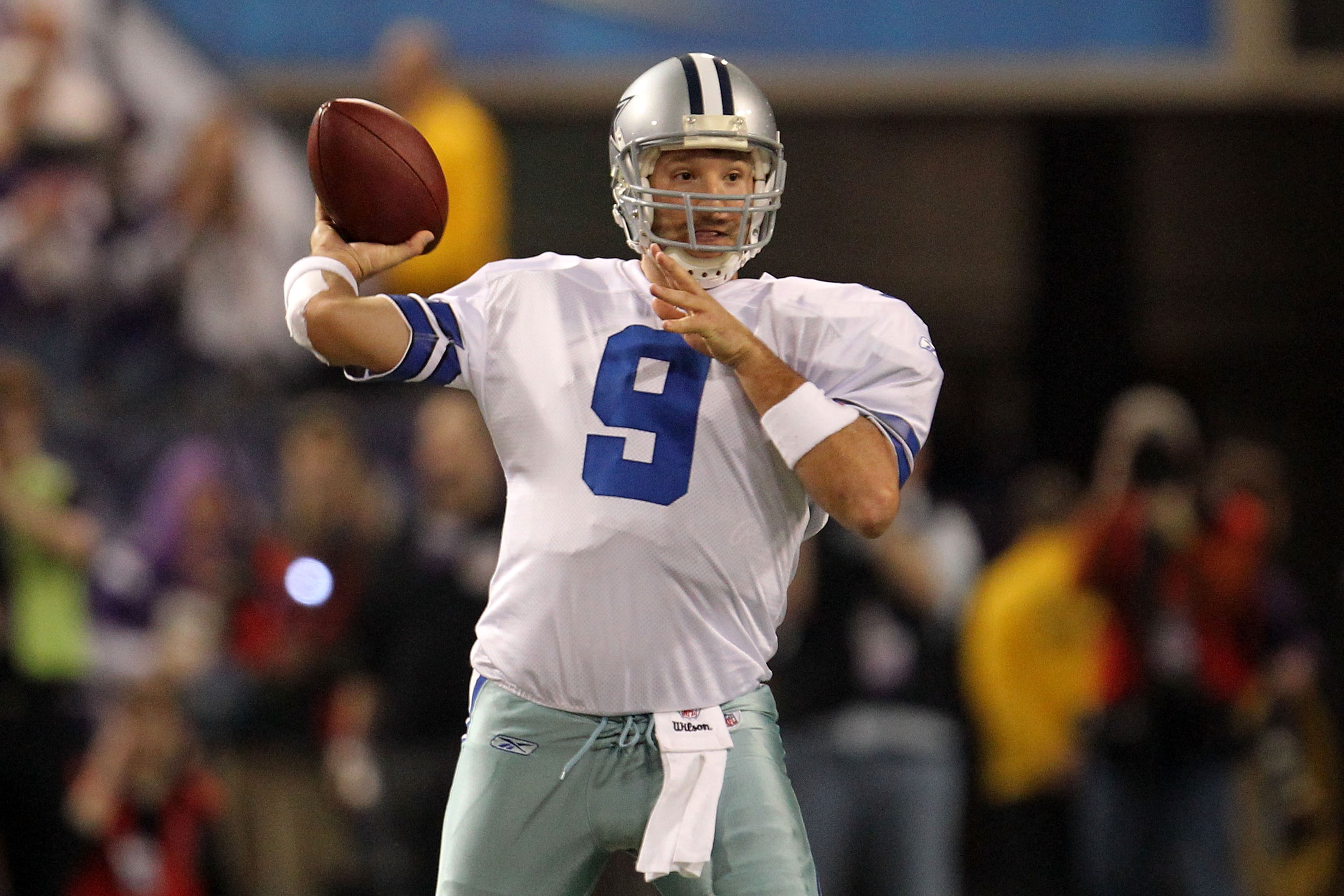 MINNEAPOLIS - JANUARY 17:  Tony Romo #9 of the Dallas Cowboys passes against the Minnesota Vikings in the first quarter of the NFC Divisional Playoff Game at Hubert H. Humphrey Metrodome on January 17, 2010 in Minneapolis, Minnesota.  (Photo by Chris McGr