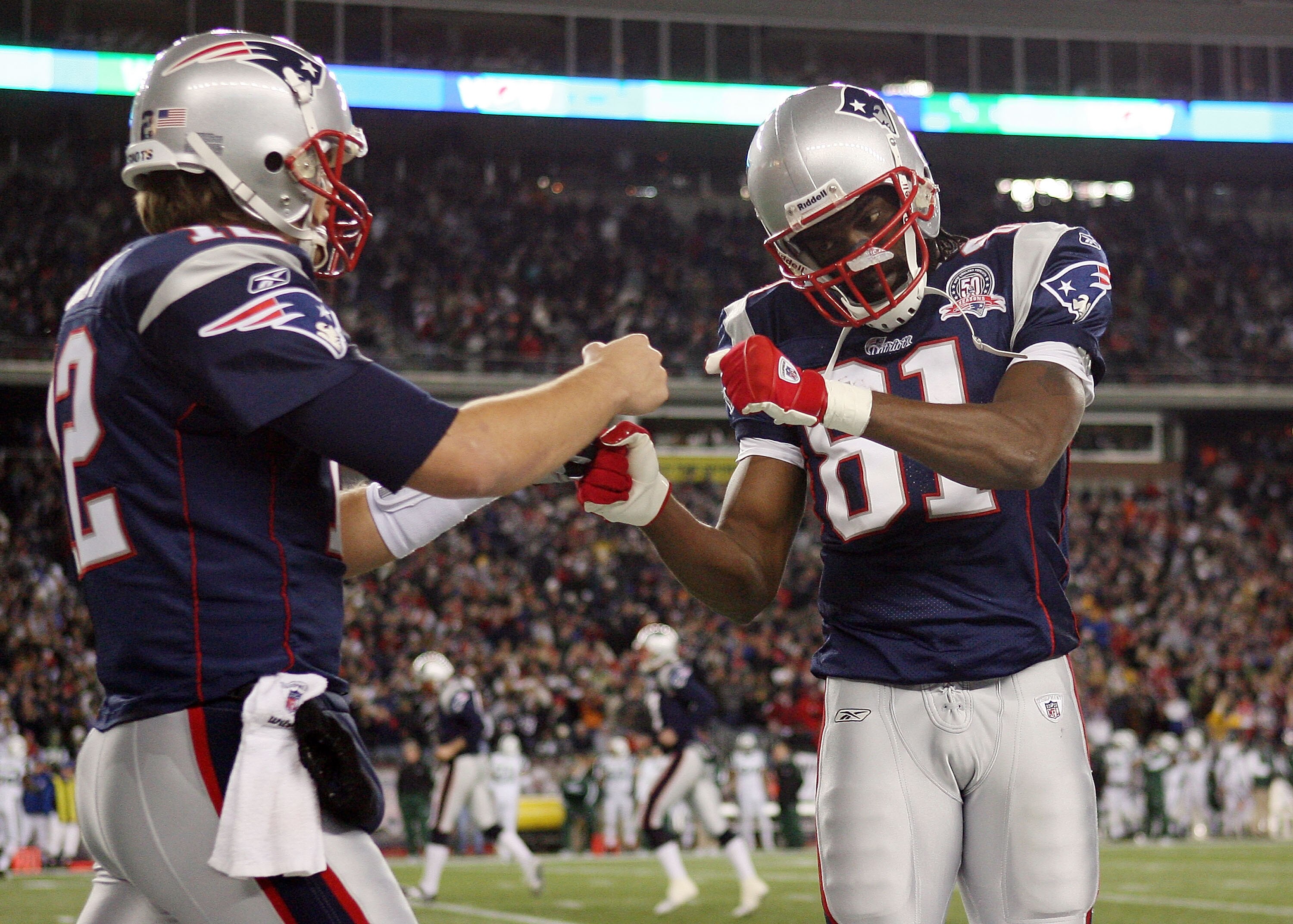 FOXBORO, MA - NOVEMBER 22:  Randy Moss #81 and Tom Brady #12 of the New England Patriots celebrate Laurence Maroney's touchdown in the second quarter against the New York Jets on November 22, 2009 at Gillette Stadium in Foxboro, Massachusetts.  (Photo by 