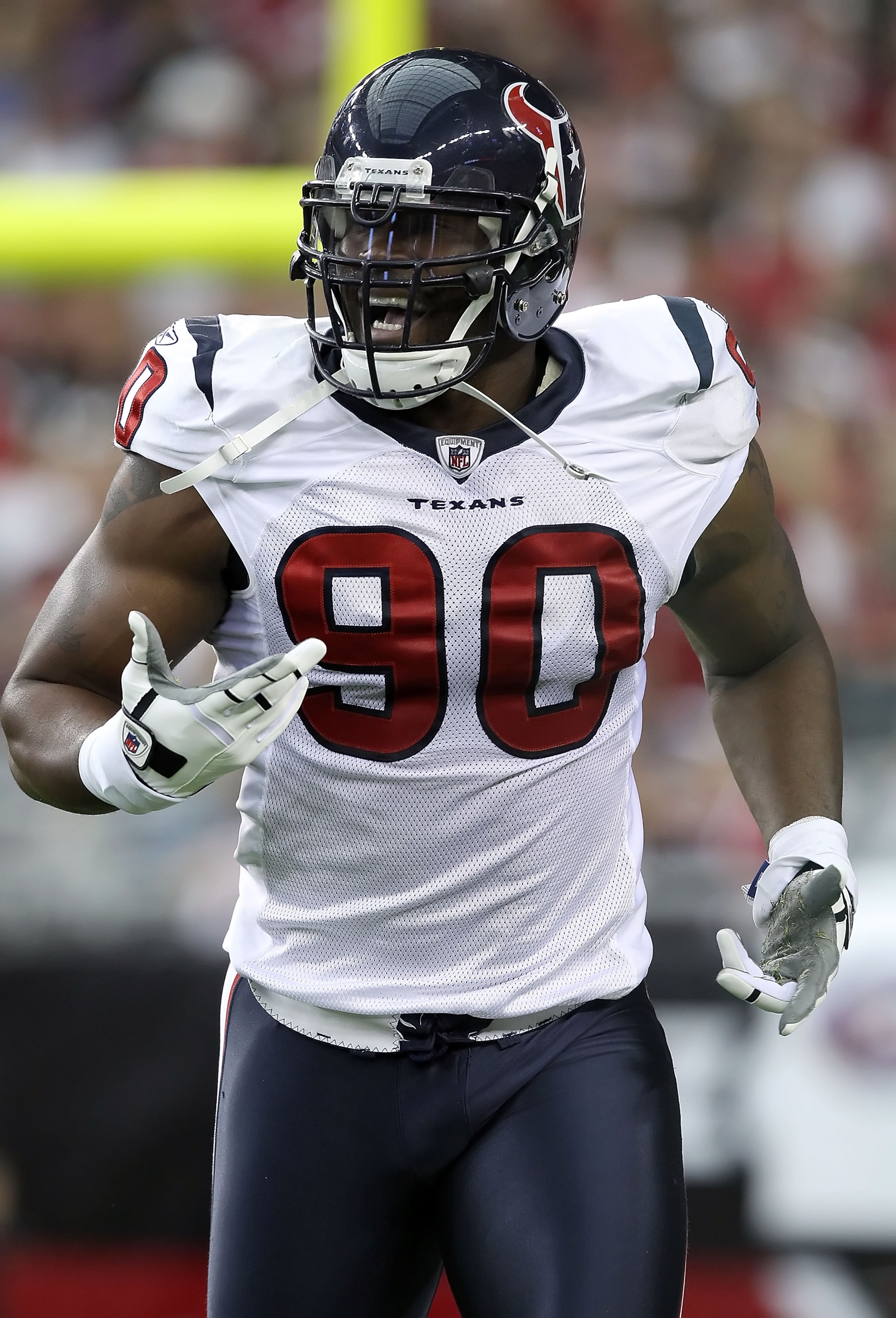 GLENDALE, AZ - AUGUST 14:  Defensive end Mario Williams #90 of the Houston Texans celebrates after a first quarter sack agianst the Arizona Cardinals during preseason NFL game at the University of Phoenix Stadium on August 14, 2010 in Glendale, Arizona.