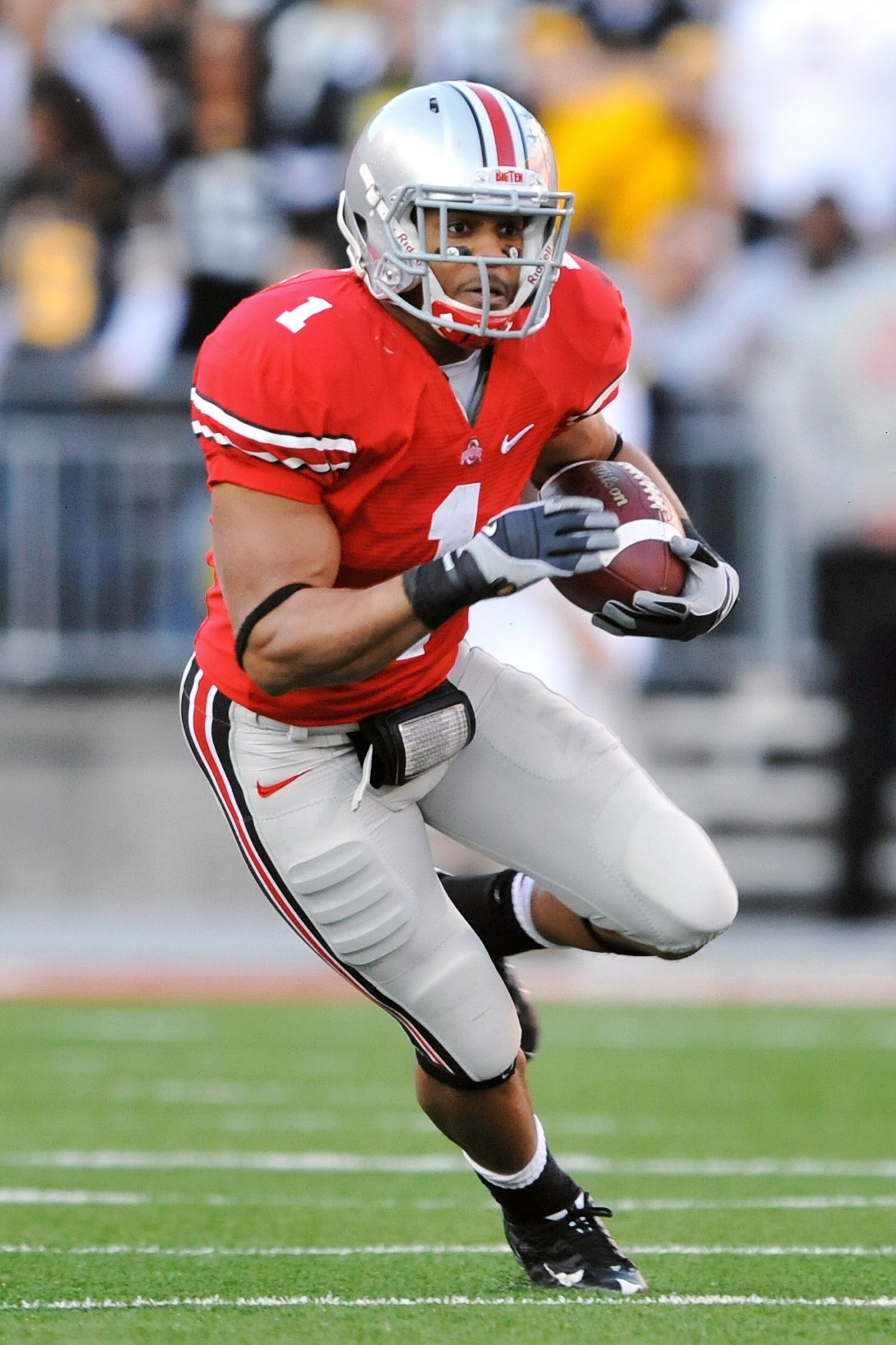 COLUMBUS, OH - NOVEMBER 14:  Tailback Dan Herron #1 of the Ohio State Buckeyes runs with the ball against the Iowa Hawkeyes at Ohio Stadium on November 14, 2009 in Columbus, Ohio.  (Photo by Jamie Sabau/Getty Images)