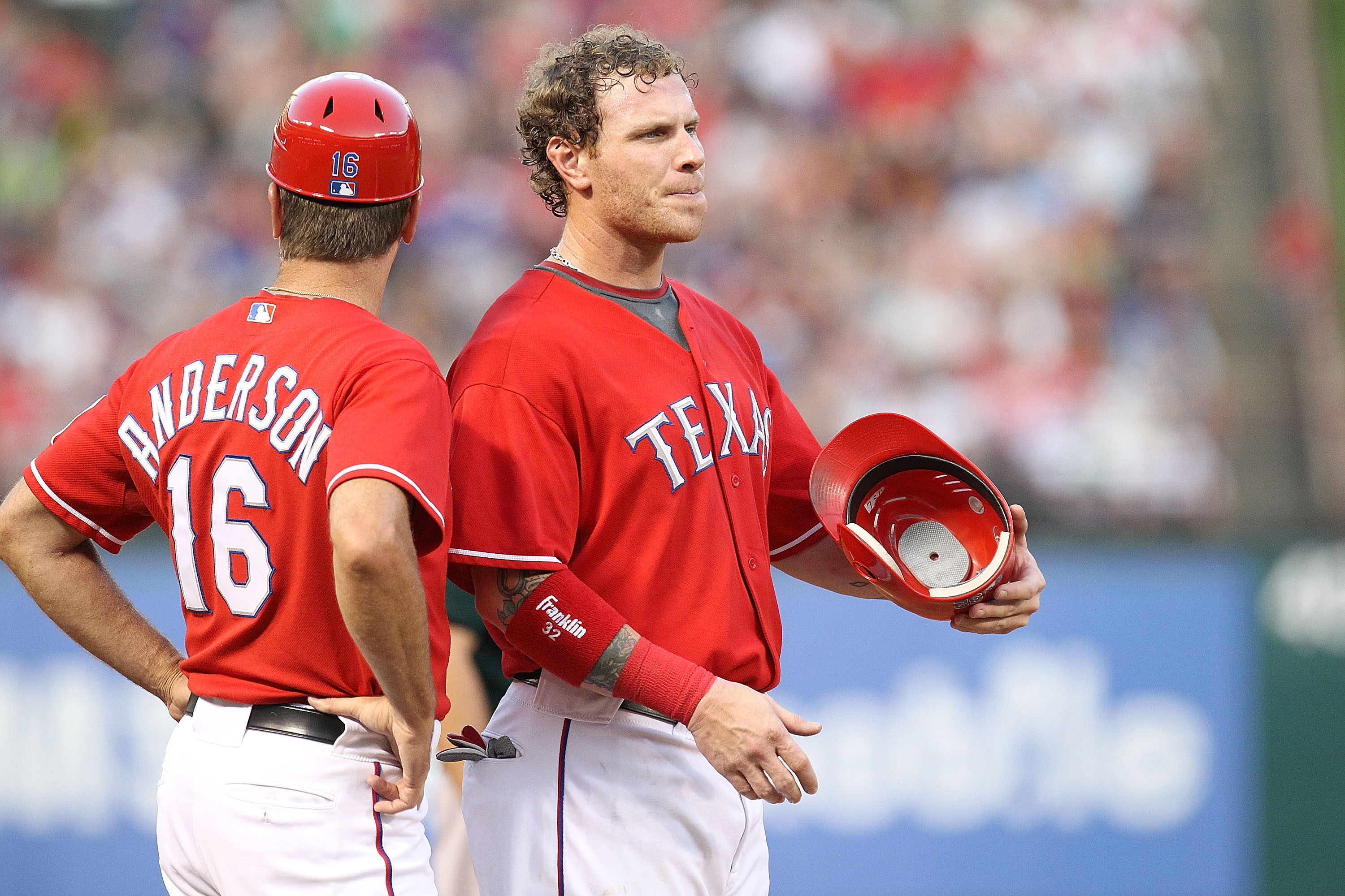 ARLINGTON, TX - JULY 29:  Third base coach Dave Anderson #16 with Josh Hamilton #32 of the Texas Rangers on July 29, 2010 at Rangers Ballpark in Arlington, Texas.  (Photo by Ronald Martinez/Getty Images)