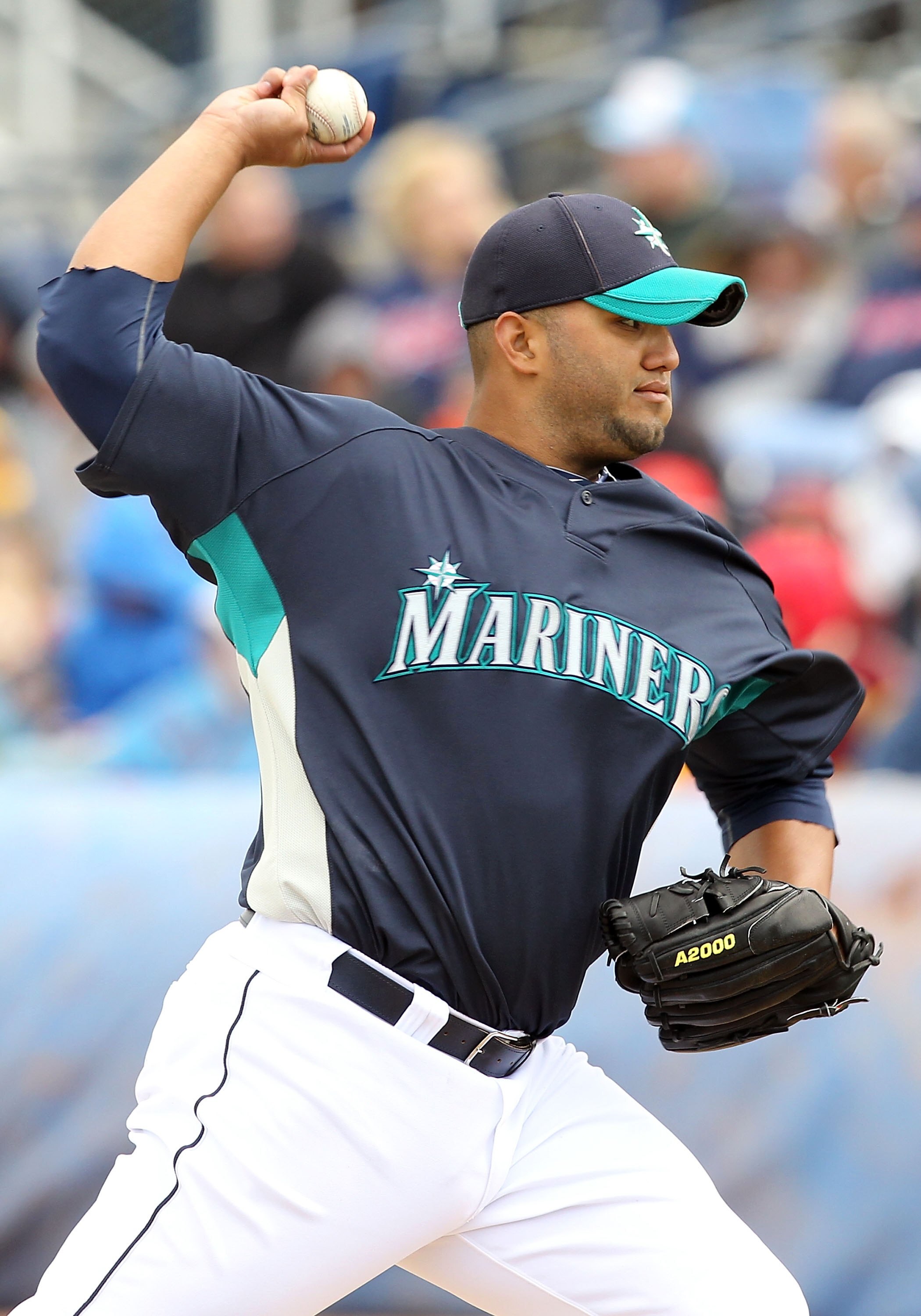 PEORIA, AZ - MARCH 09:  Releif pitcher Yusmeiro Petit #52 of the Seattle Mariners pitches against the Cleveland Indians during the MLB spring training game at Peoria Stadium on March 9, 2010 in Peoria, Arizona. The Indians defeated the Mariners 6-4.  (Pho