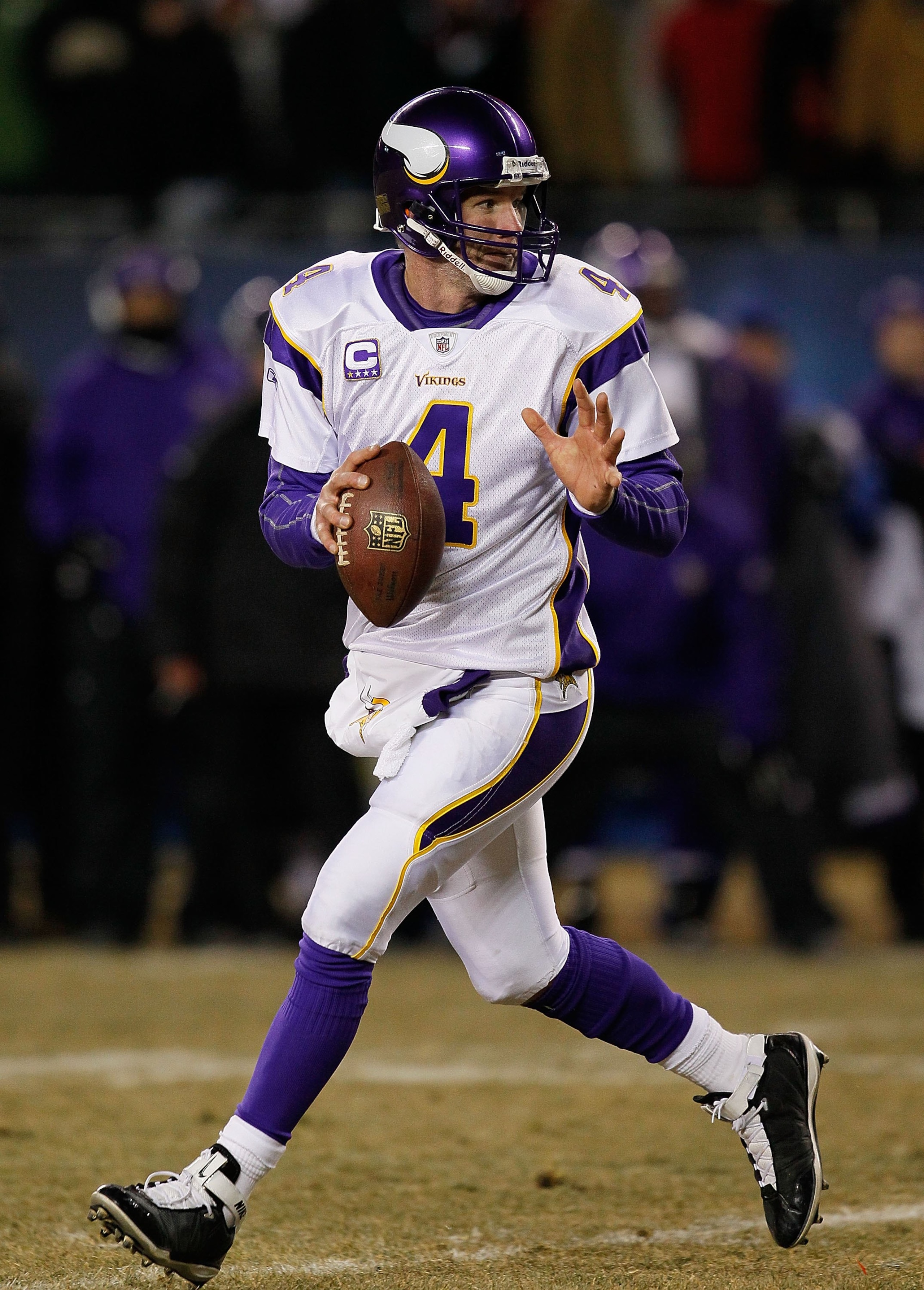 CHICAGO - DECEMBER 28: Brett Favre #4 of the Minnesota Vikings looks for a receiver against the Chicago Bears at Soldier Field on December 28, 2009 in Chicago, Illinois. The Bears defeated the Vikings 36-30 in overtime. (Photo by Jonathan Daniel/Getty Ima