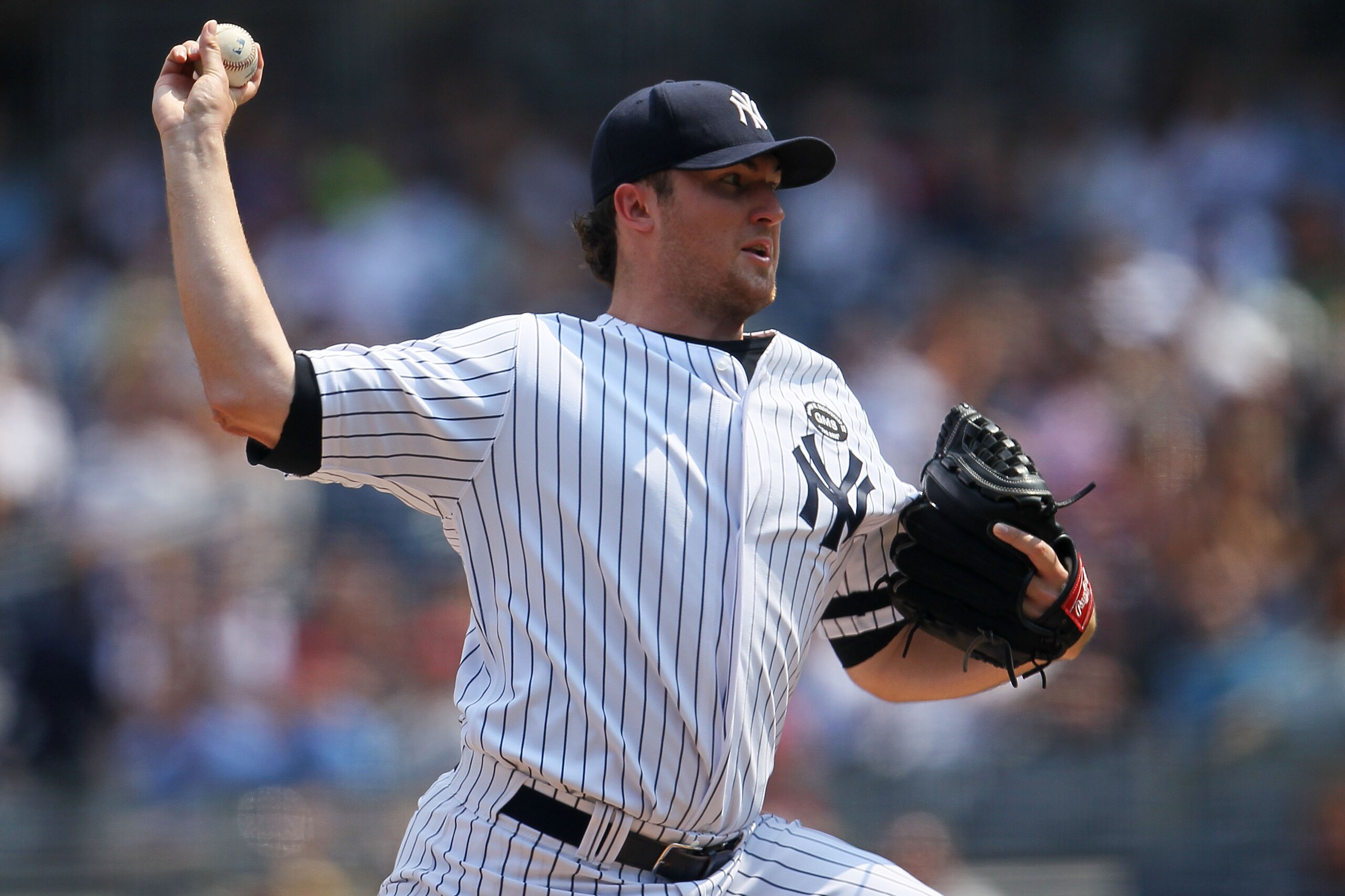 NEW YORK - AUGUST 09:  Phil Hughes #65 of the New York Yankees pitches against the Boston Red Sox during their game on August 9, 2010 at Yankee Stadium in the Bronx borough of New York City.  (Photo by Chris McGrath/Getty Images)