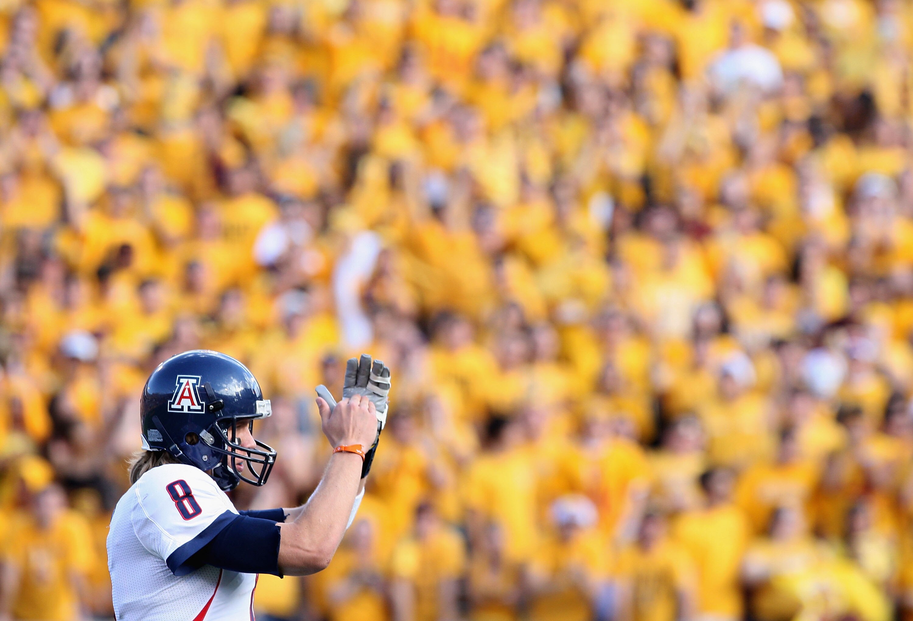 TEMPE, AZ - NOVEMBER 28:  Quarterback Nick Foles #8 of the Arizona Wildcats calls a time out during the college football game against the Arizona State Sun Devils at Sun Devil Stadium on November 28, 2009 in Tempe, Arizona. The Wildcats defeated the Sun D