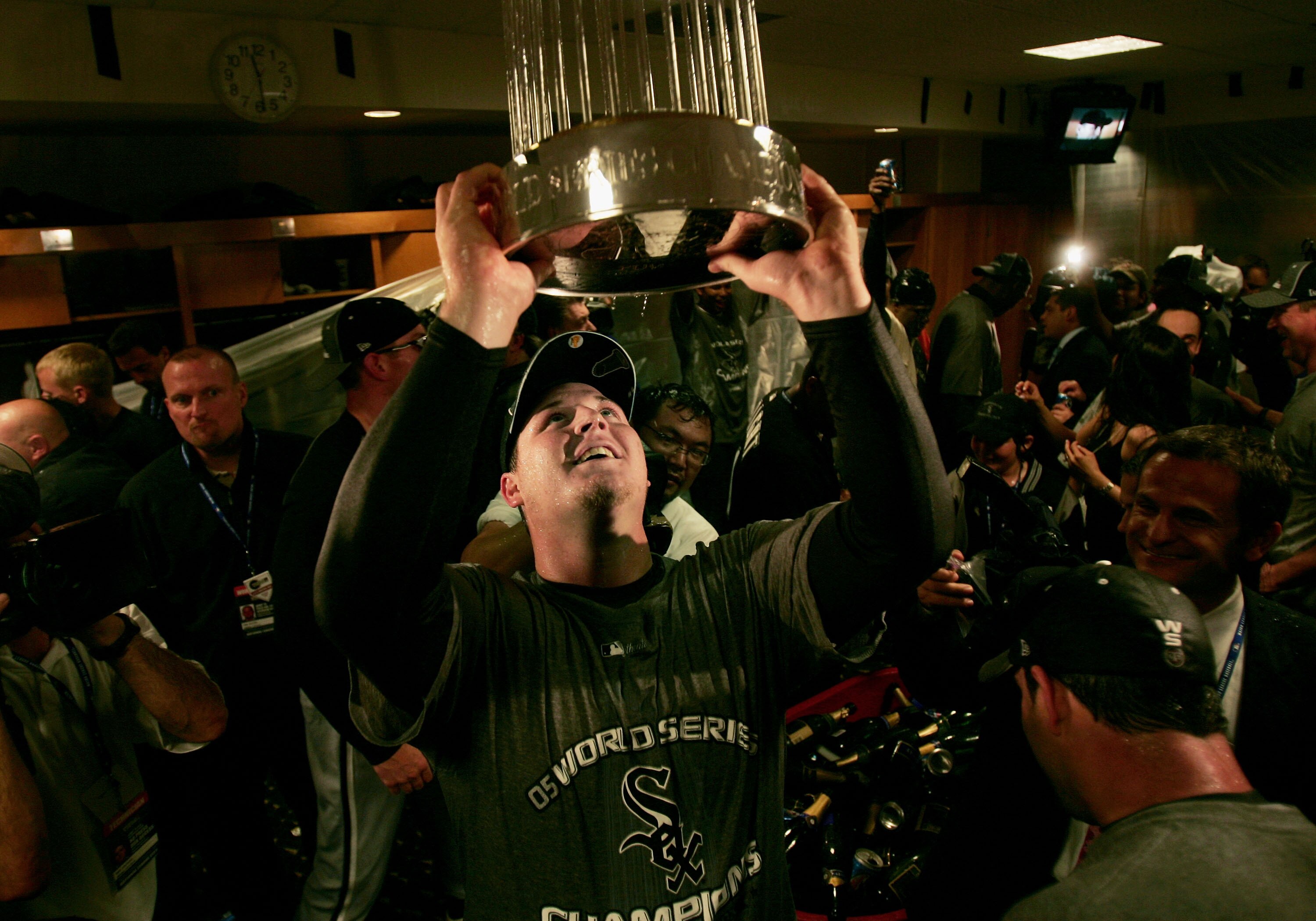 HOUSTON - OCTOBER 26:  Pitcher Bobby Jenks #45 of the Chicago White Sox celebrates in the locker room with the championship trophy after winning Game Four of the 2005 Major League Baseball World Series against the Houston Astros at Minute Maid Park on Oct