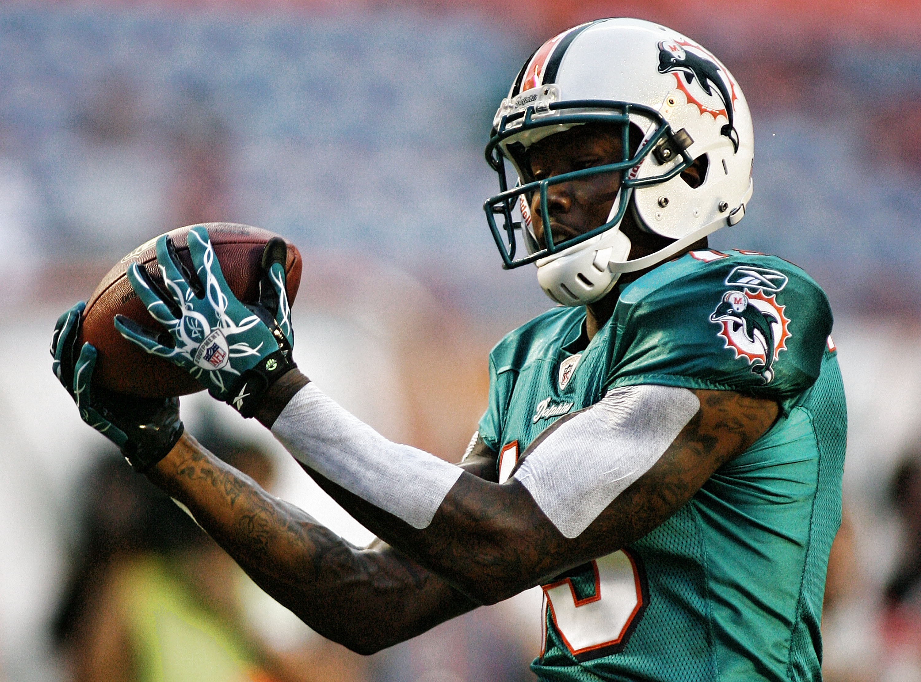 MIAMI - AUGUST 14:  Wide Receiver Brandon Marshall #19 of the Miami Dolphins warms up prior to playing the Tampa Bay Buccaneers in a preseason game at Sun Life Stadium on August 14, 2010 in Miami, Florida.  (Photo by Marc Serota/Getty Images)