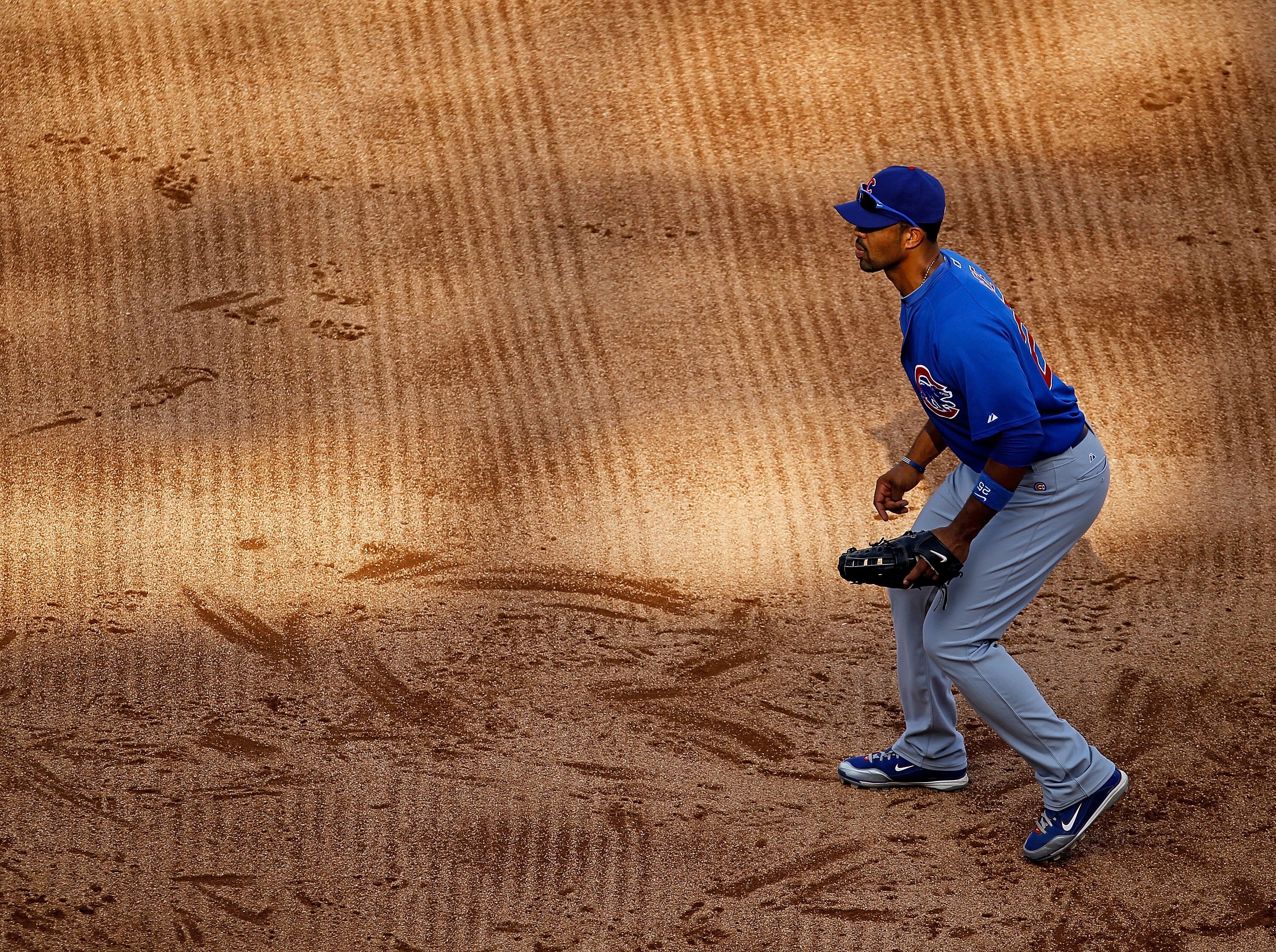 CHICAGO - JUNE 25: Derrek Lee #25 of the Chicago Cubs awaits the pitch near first base against the Chicago White Sox at U.S. Cellular Field on June 25, 2010 in Chicago, Illinois. The White Sox defeated the Cubs 6-0. (Photo by Jonathan Daniel/Getty Images)