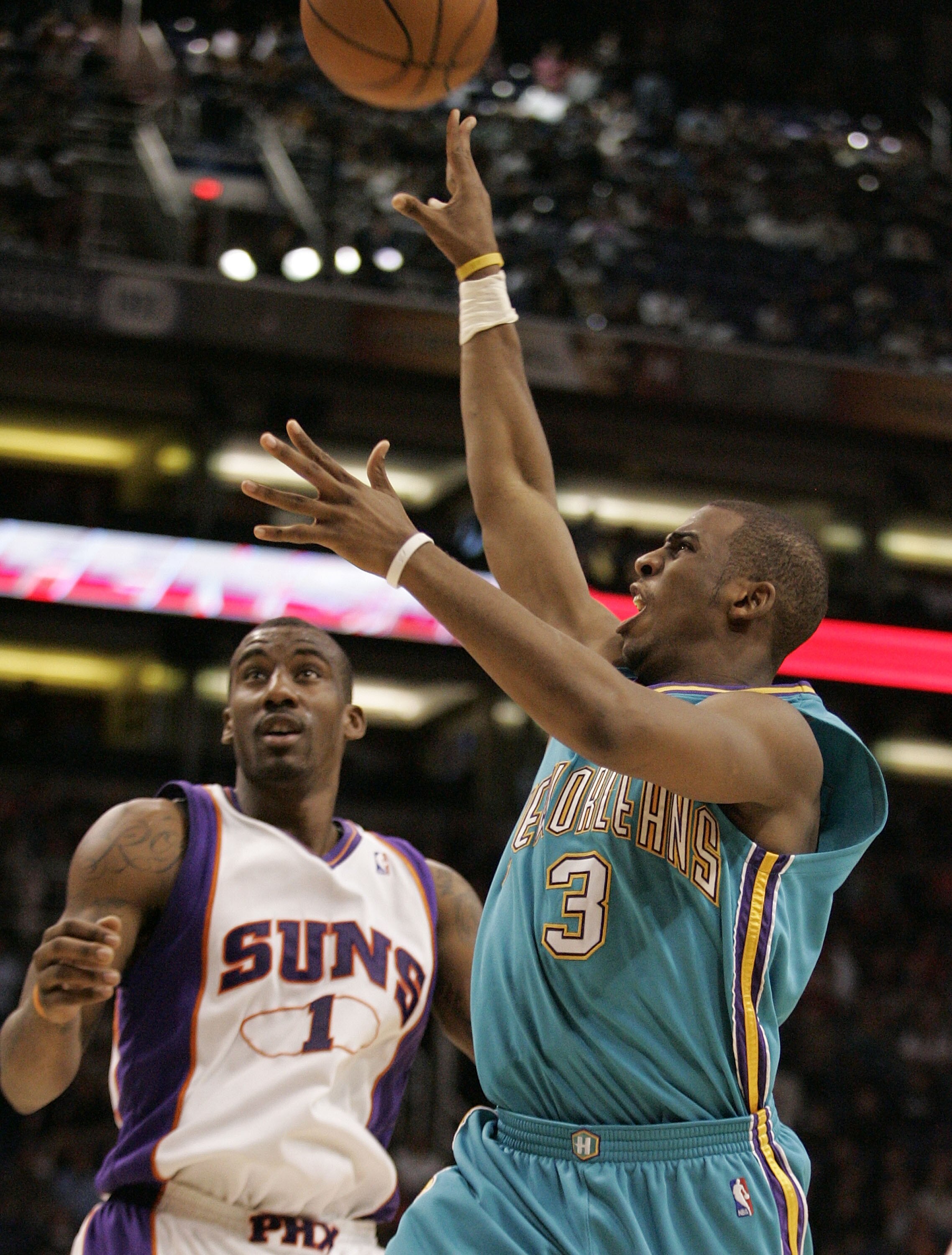 PHOENIX - FEBRUARY 06:  Chris Paul #3 of the New Orleans Hornets shoots over Amare Stoudemire #1 of the Phoenix Suns on February 6, 2008 at US Airways Center in Phoenix, Arizona. NOTE TO USER: User expressly acknowledges and agrees that, by downloading an