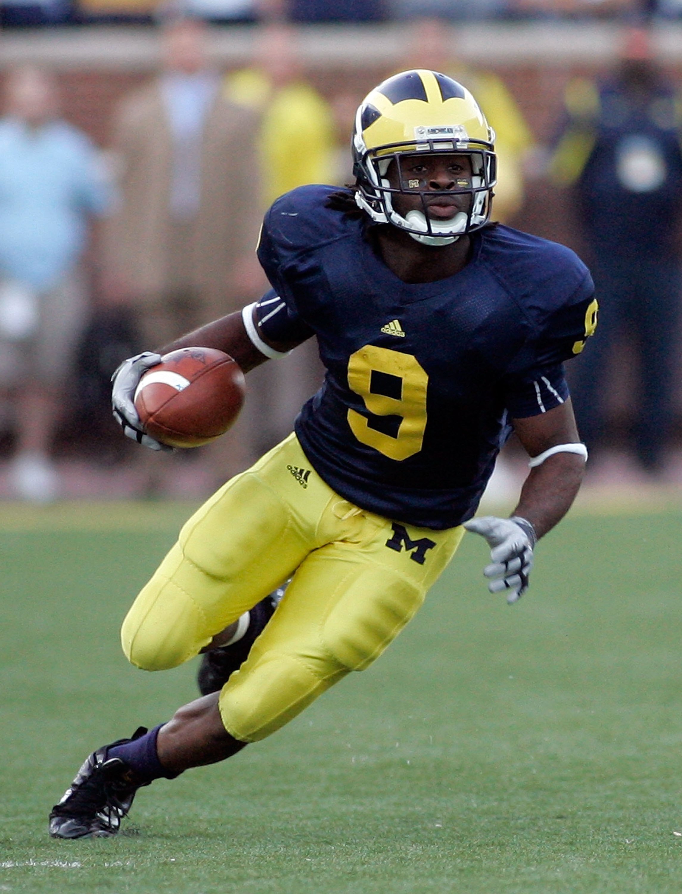 ANN ARBOR, MI - SEPTEMBER 12:  Martavious Odoms #9 of Michigan runs with the ball against Notre Dame at Michigan Stadium on September 12, 2009 in Ann Arbor, Michigan.  (Photo by Domenic Centofanti/Getty Images)