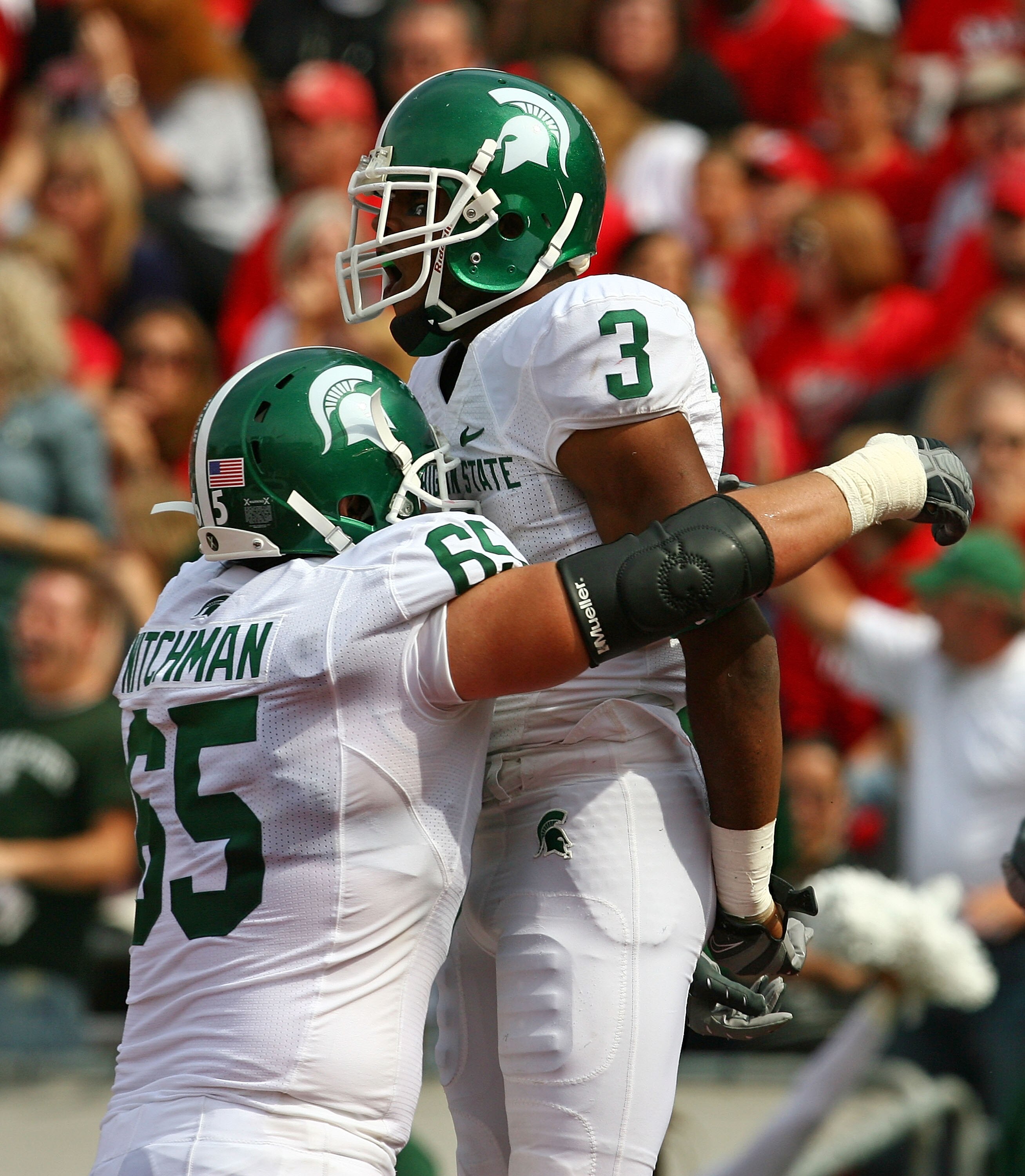 MADISON, WI - SEPTEMBER 26: B.J. Cunningham #3 of the Michigan State Spartans celebrates a touchdown catch with teammate Joel Nitchman #65 against the Wisconsin Badgers on September 26, 2009 at Camp Randall Stadium in Madison, Wisconsin. Wisconsin defeate