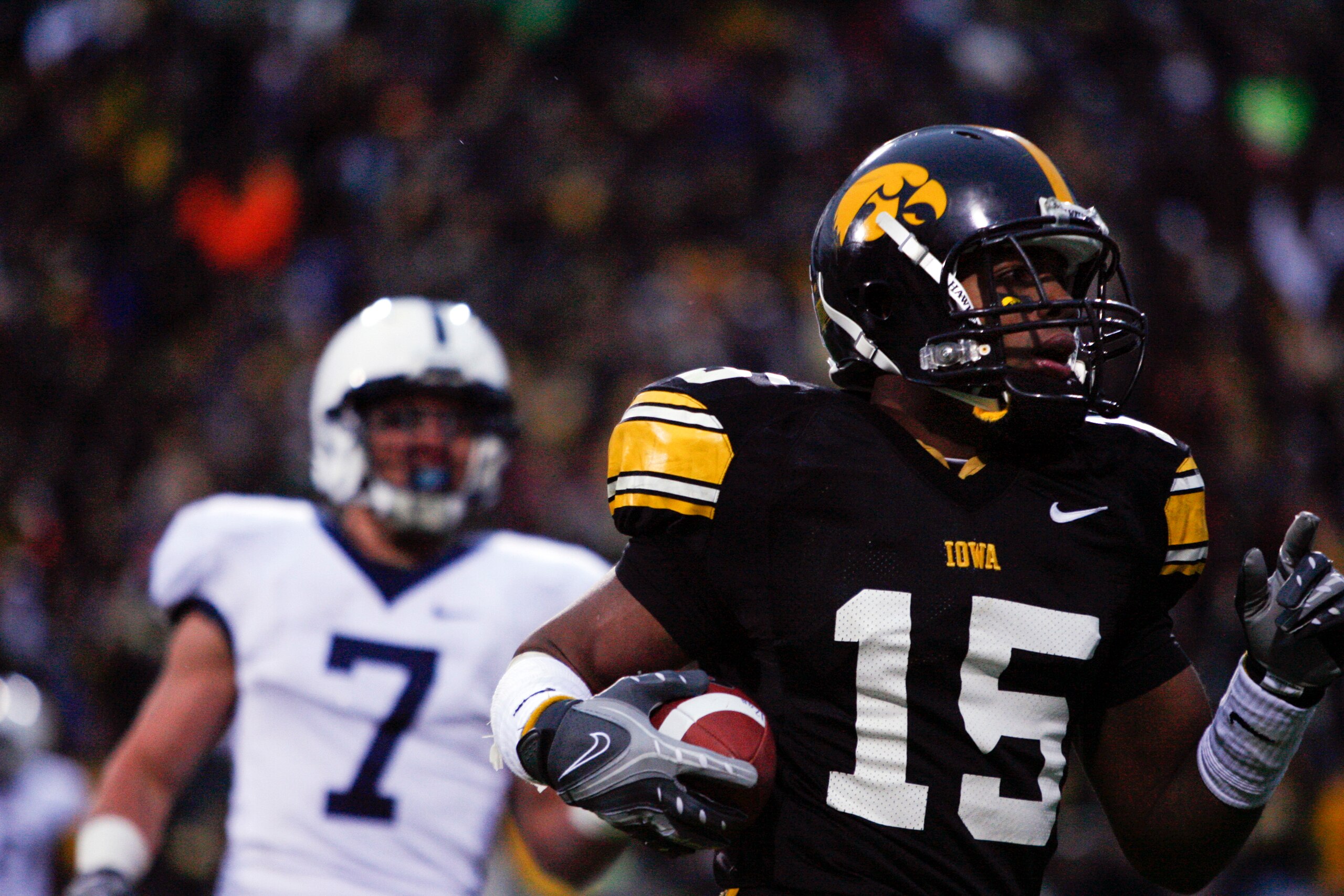 IOWA CITY, IA - NOVEMBER 8: Wide receiver Derrell Johnson-Koulianos #15 of the Iowa Hawkeyes scores a touchdown in the third quarter of play as Anthony Scirrotto #7 of the Penn State Nittany Lions defends on the play at Kinnick Stadium on November 8, 2008