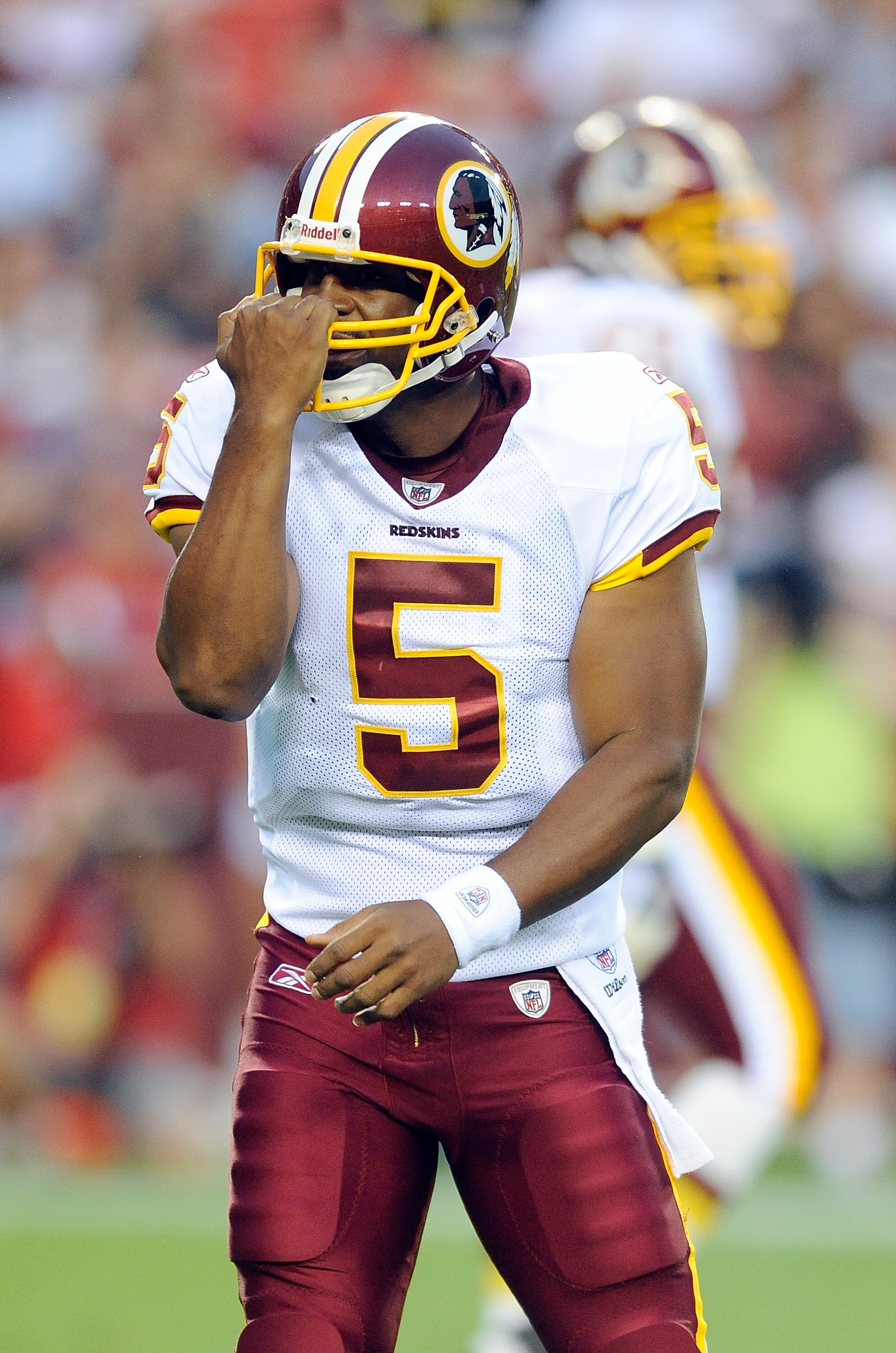 LANDOVER, MD - AUGUST 13:  Donovan McNabb #5 of the Washington Redskins motions for a facemask call during the preseason game against the Buffalo Bills at FedEx Field on August 13, 2010 in Landover, Maryland.  (Photo by Greg Fiume/Getty Images)