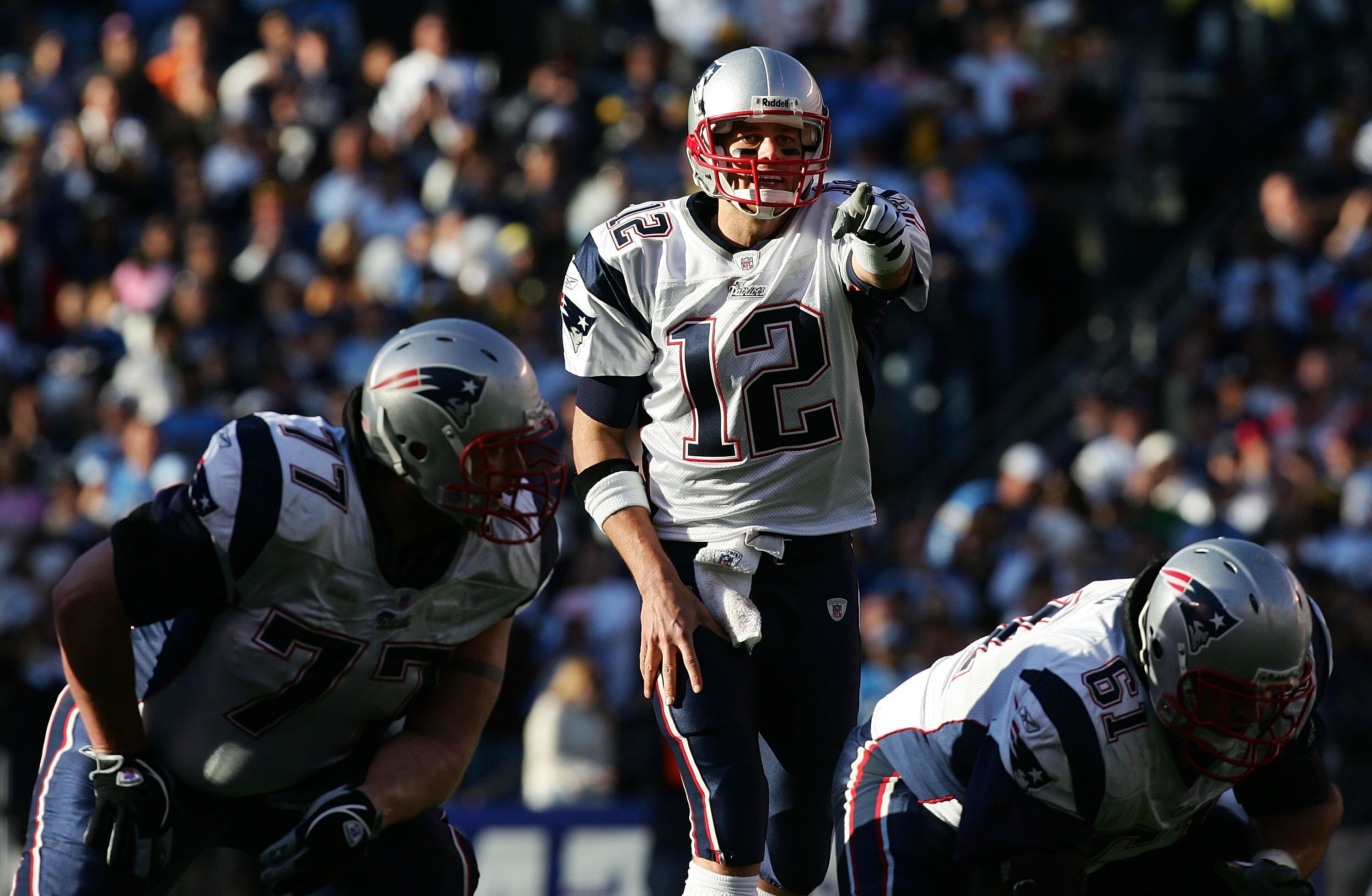 SAN DIEGO - JANUARY 14: Quarterback Tom Brady #12 of the New England Patriots points in the second quarter against the San Diego Chargers during the AFC Divisional Playoff Game held on January 14, 2007 at Qualcomm Stadium in San Diego, California.  (Photo