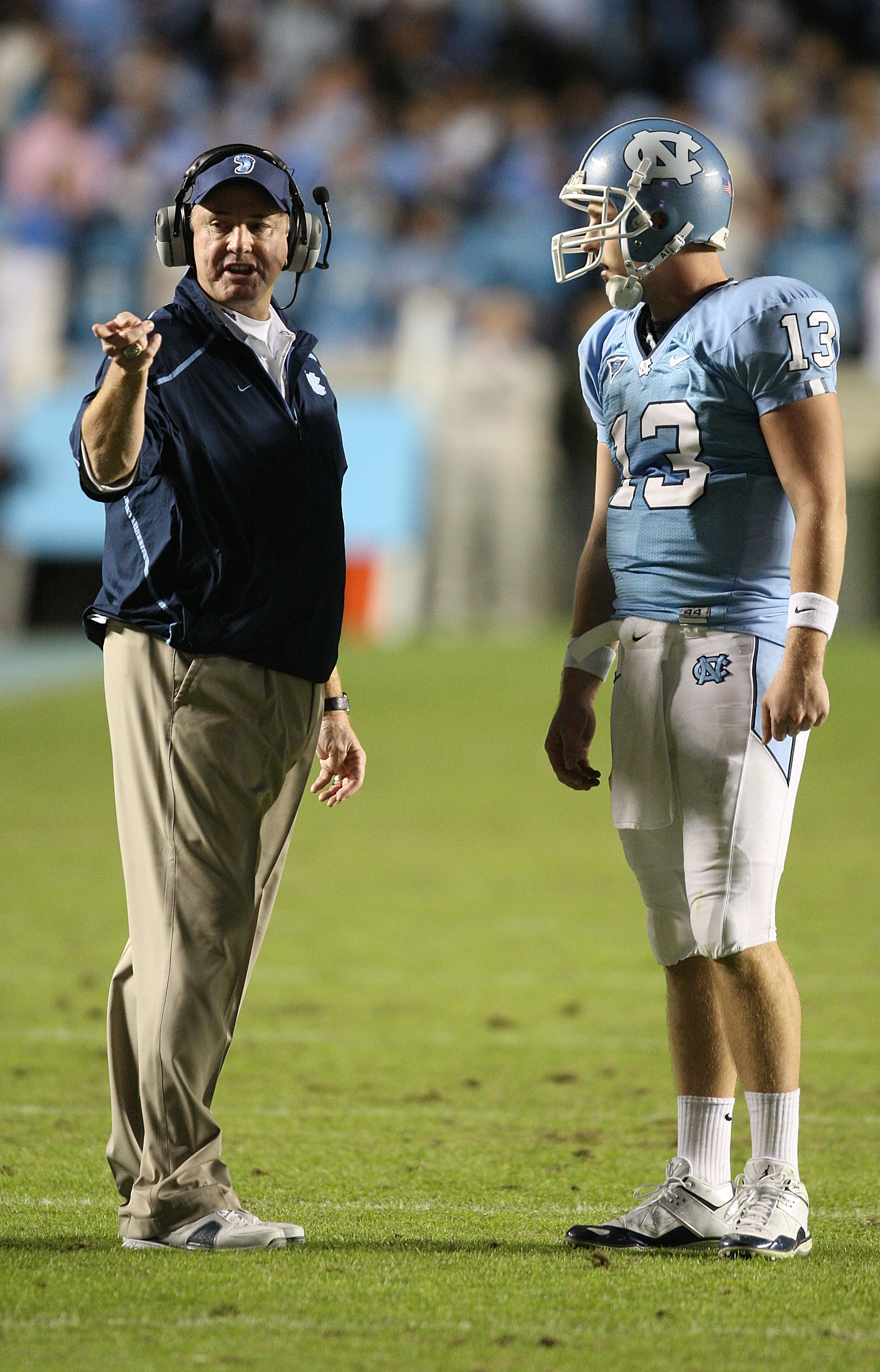CHAPEL HILL, NC - NOVEMBER 07:  Head coach Butch Davis (L) stands with his quarterback T.J. Yates #13 of the North Carolina Tar Heels during their game against the Duke Blue Devilsat Kenan Stadium on November 7, 2009 in Chapel Hill, North Carolina.  (Phot
