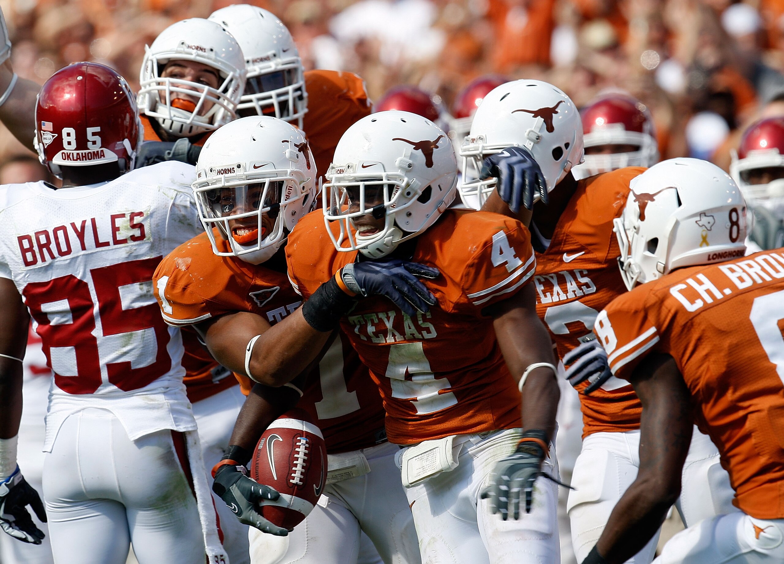 DALLAS - OCTOBER 17: Defensive back Aaron Williams #4 of the Texas Longhorns celebrates a pass interception with Deon Beasley against the Oklahoma Sooners at Cotton Bowl on October 17, 2009 in Dallas, Texas. (Photo by Ronald Martinez/Getty Images) DALLAS - OCTOBER 17: Defensive back Aaron Williams #4 of the Texas Longhorns celebrates a pass interception with Deon Beasley against the Oklahoma Sooners at Cotton Bowl on October 17, 2009 in Dallas, Texas. (Photo by Ronald Martinez/Getty Images)