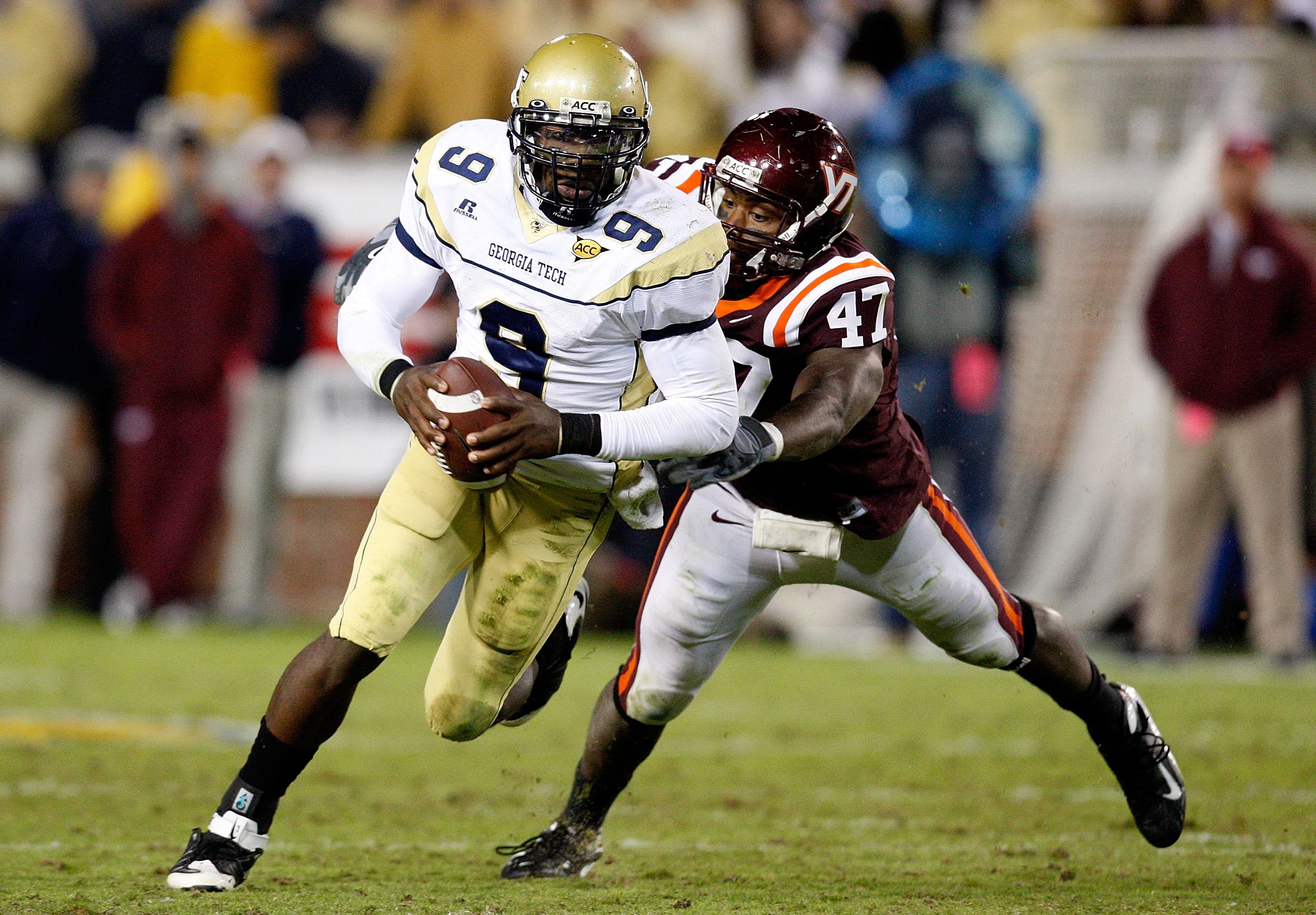 ATLANTA - OCTOBER 17:  Quarterback Josh Nesbitt #9 of the Georgia Tech Yellow Jackets rushes upfield away from Nekos Brown #47 of the Virginia Tech Hokies at Bobby Dodd Stadium on October 17, 2009 in Atlanta, Georgia.  (Photo by Kevin C. Cox/Getty Images)