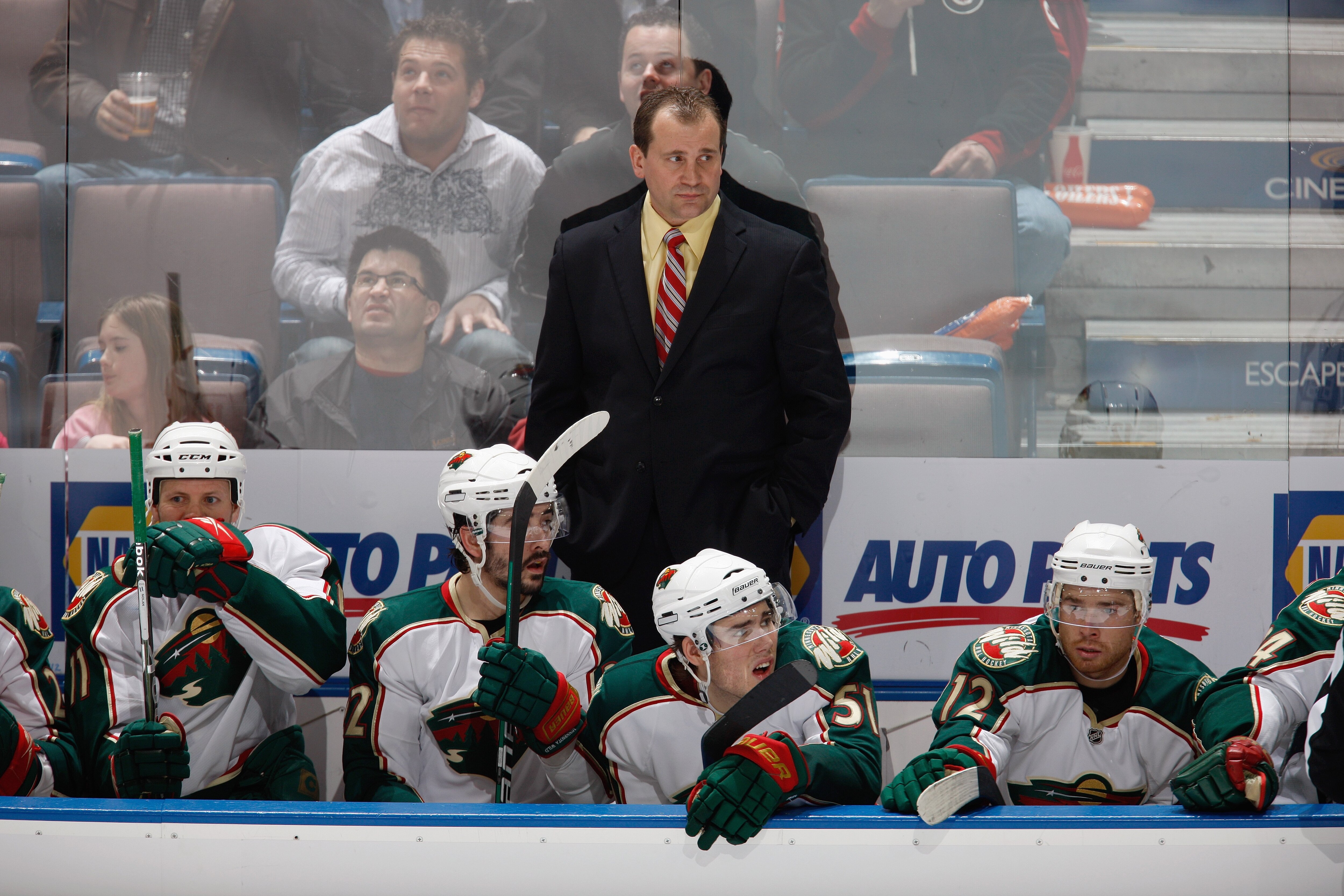EDMONTON, CANADA - MARCH 5: Head Coach Todd Richards with James Sheppard #51 and Chuck Kobasew #12 of the Minnesota Wild watch the action against the Edmonton Oilers on March 5, 2010 at Rexall Place in Edmonton, Alberta, Canada. (Photo by Dale MacMillan/G