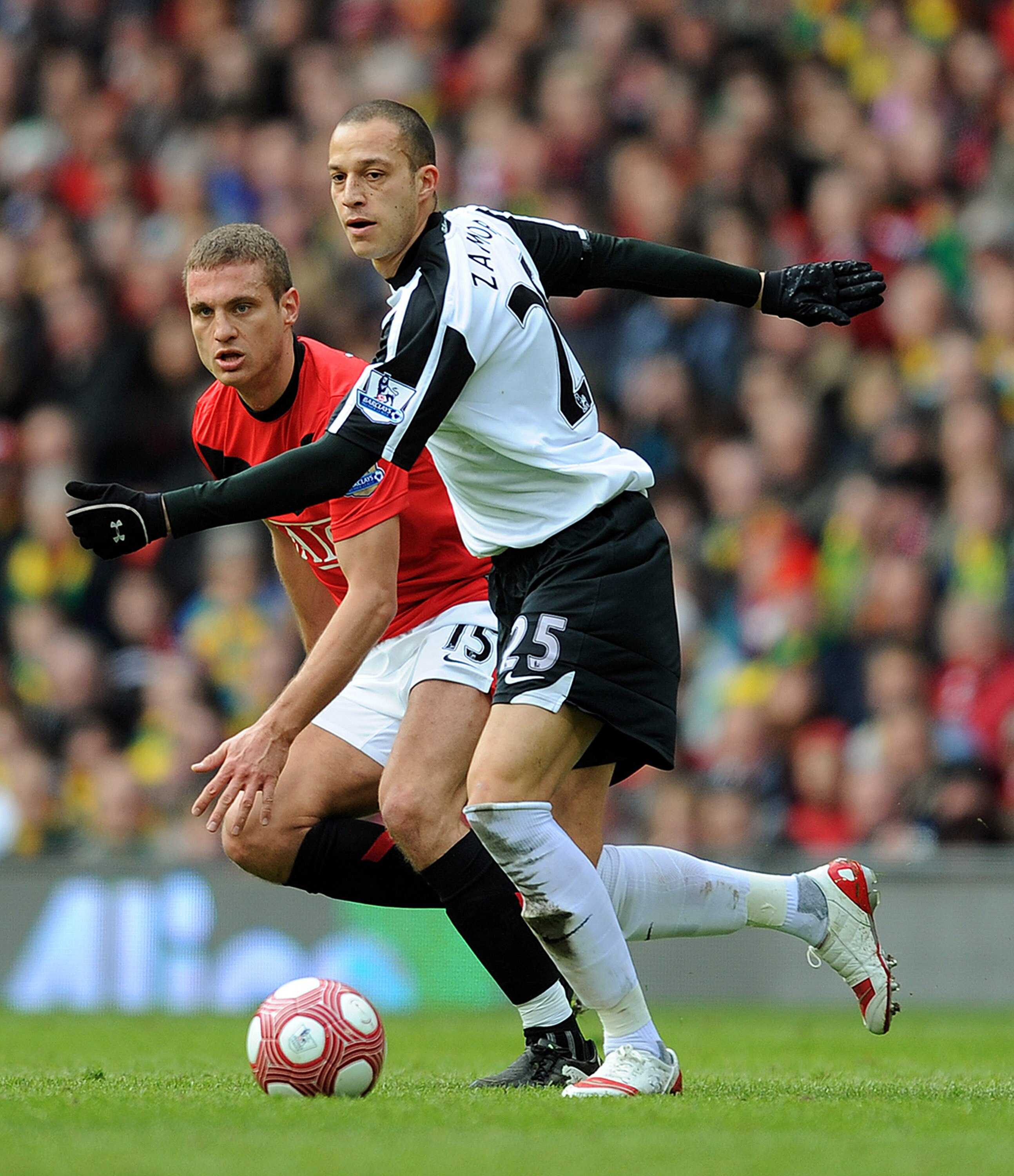 MANCHESTER, ENGLAND - MARCH 14: Bobby Zamora of Fulham in action with Nemanja Vidic of Manchester United during the Barclays Premier League match between Manchester United and Fulham at Old Trafford on March 14, 2010 in Manchester, England.  (Photo by Mic
