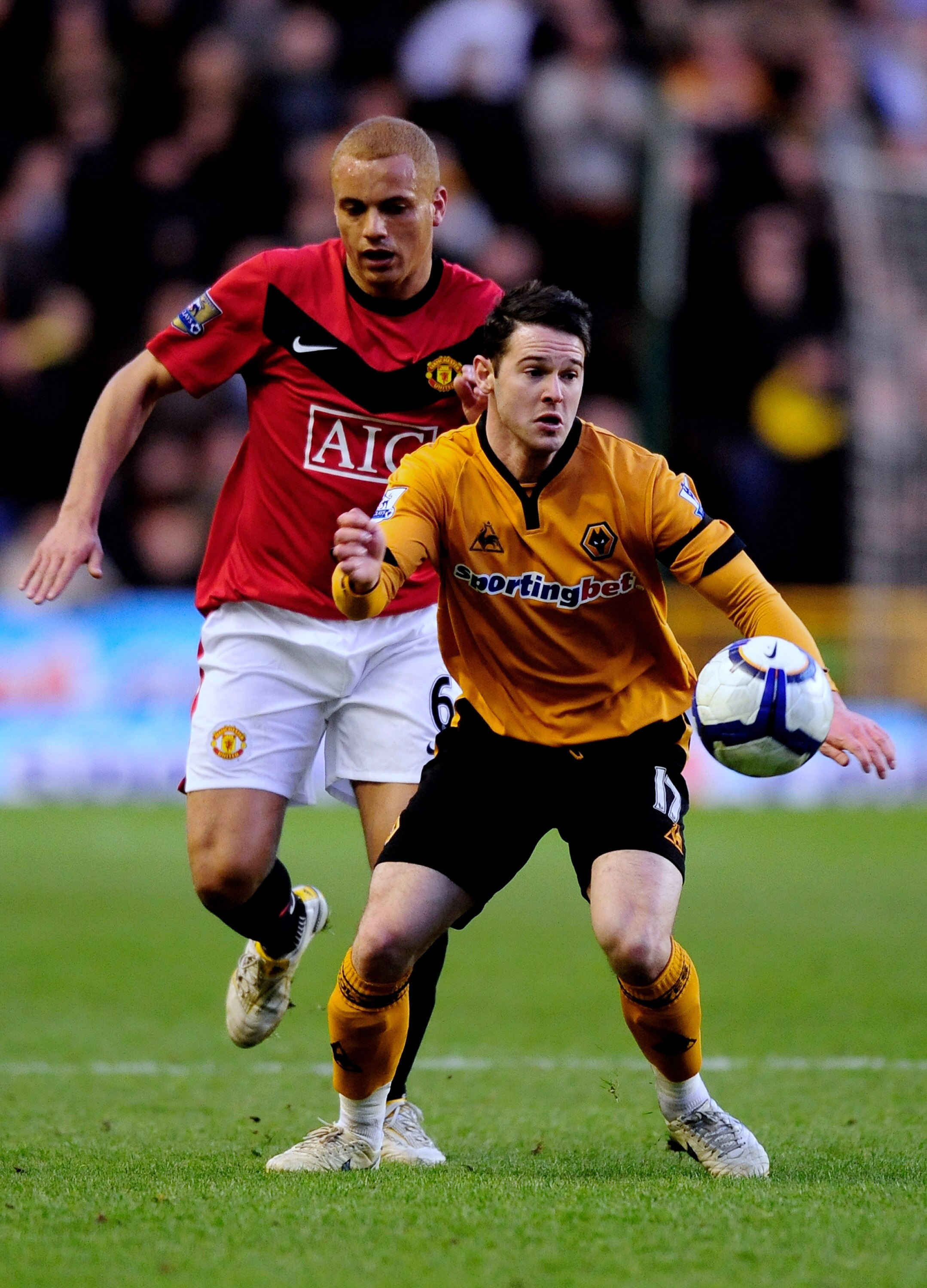 WOLVERHAMPTON, ENGLAND - MARCH 06:  Matt Jarvis (R) of Wolves battles with Wes Brown of Manchester United during the Barclays Premier League match between Wolverhampton Wanderers and Manchester United at Molineux on March 6, 2010 in Wolverhampton, England