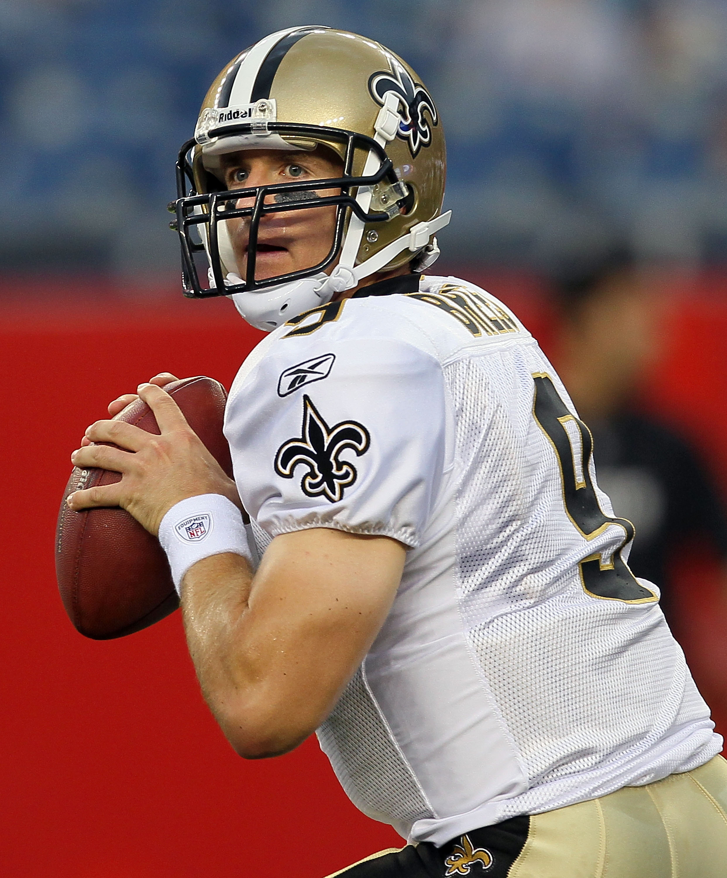 FOXBORO, MA - AUGUST 12: Drew Brees #9 of the New Orleans Saints looks to pass during pregame of the preseason game against the New England Patriots at Gillette Stadium on August 12, 2010 in Foxboro, Massachusetts. (Photo by Jim Rogash/Getty Images)