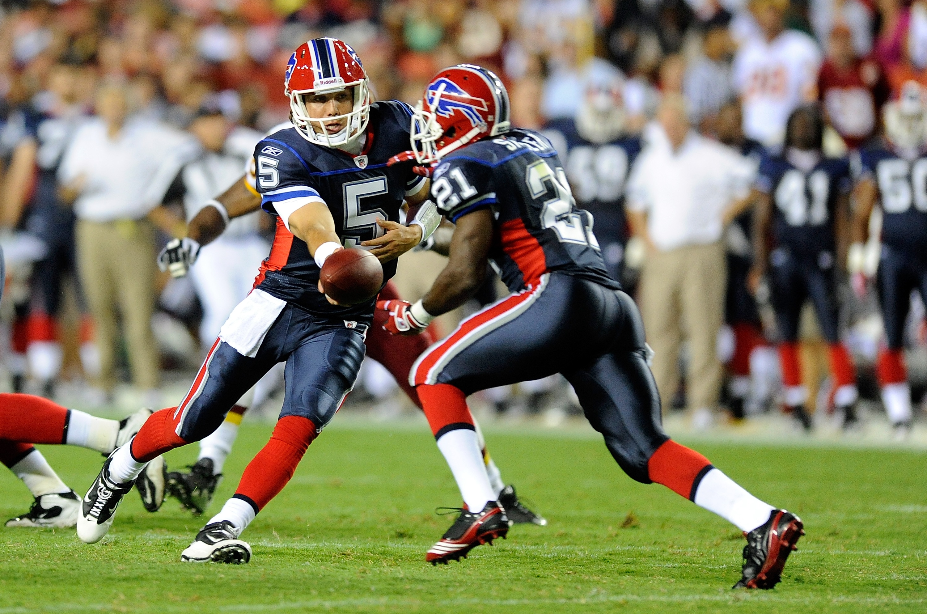 LANDOVER, MD - AUGUST 13:  Trent Edwards #5 of the Buffalo Bills hands the ball off to C.J. Spiller #21 during the preseason game against the Washington Redskins at FedEx Field on August 13, 2010 in Landover, Maryland.  (Photo by Greg Fiume/Getty Images)