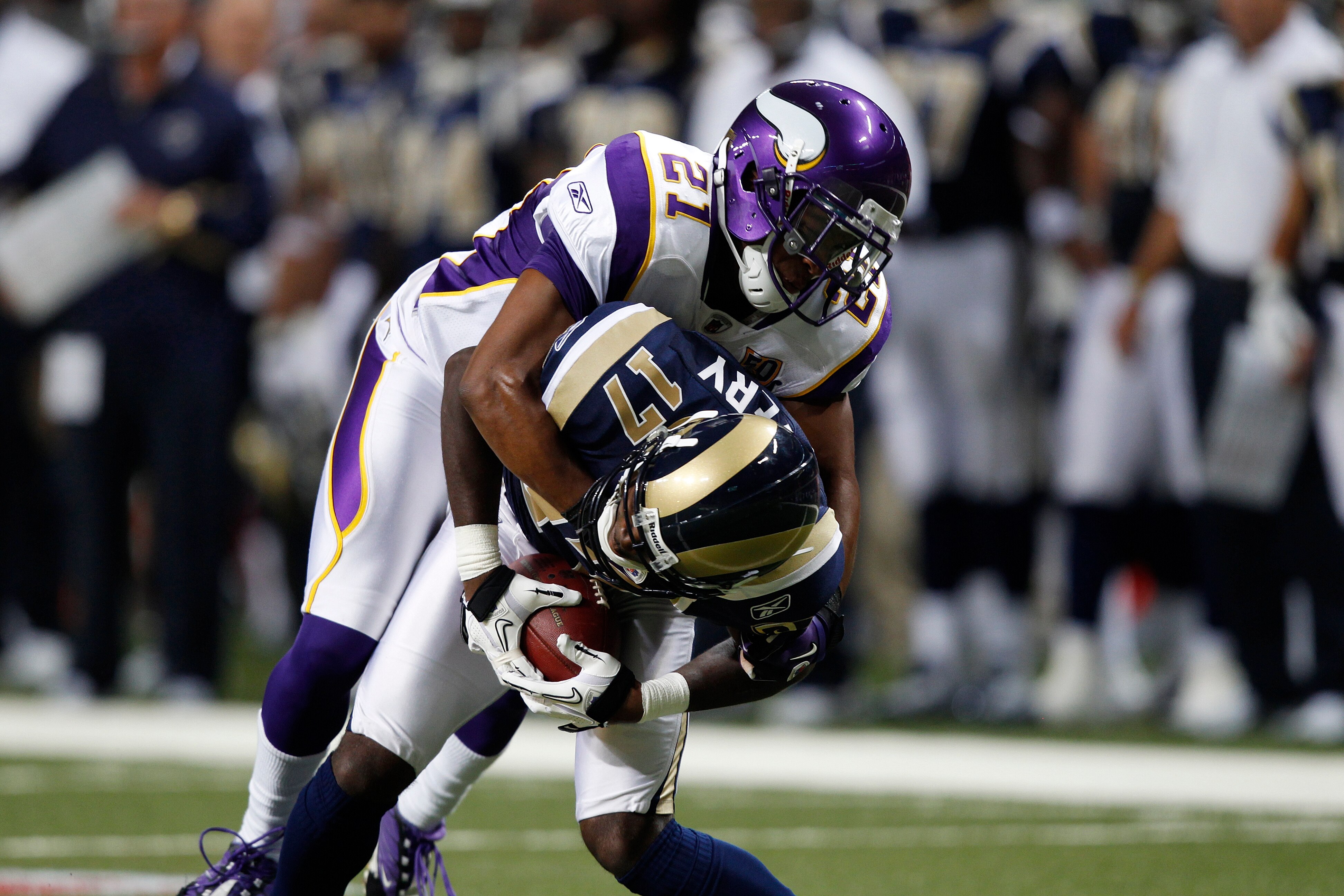 ST. LOUIS, MO - AUGUST 14: Asher Allen #21 of the Minnesota Vikings tackles Donnie Avery #17 of the St. Louis Rams during the preseason game at Edward Jones Dome on August 14, 2010 in St. Louis, Missouri. The Vikings defeated the Rams 28-7. (Photo by Joe