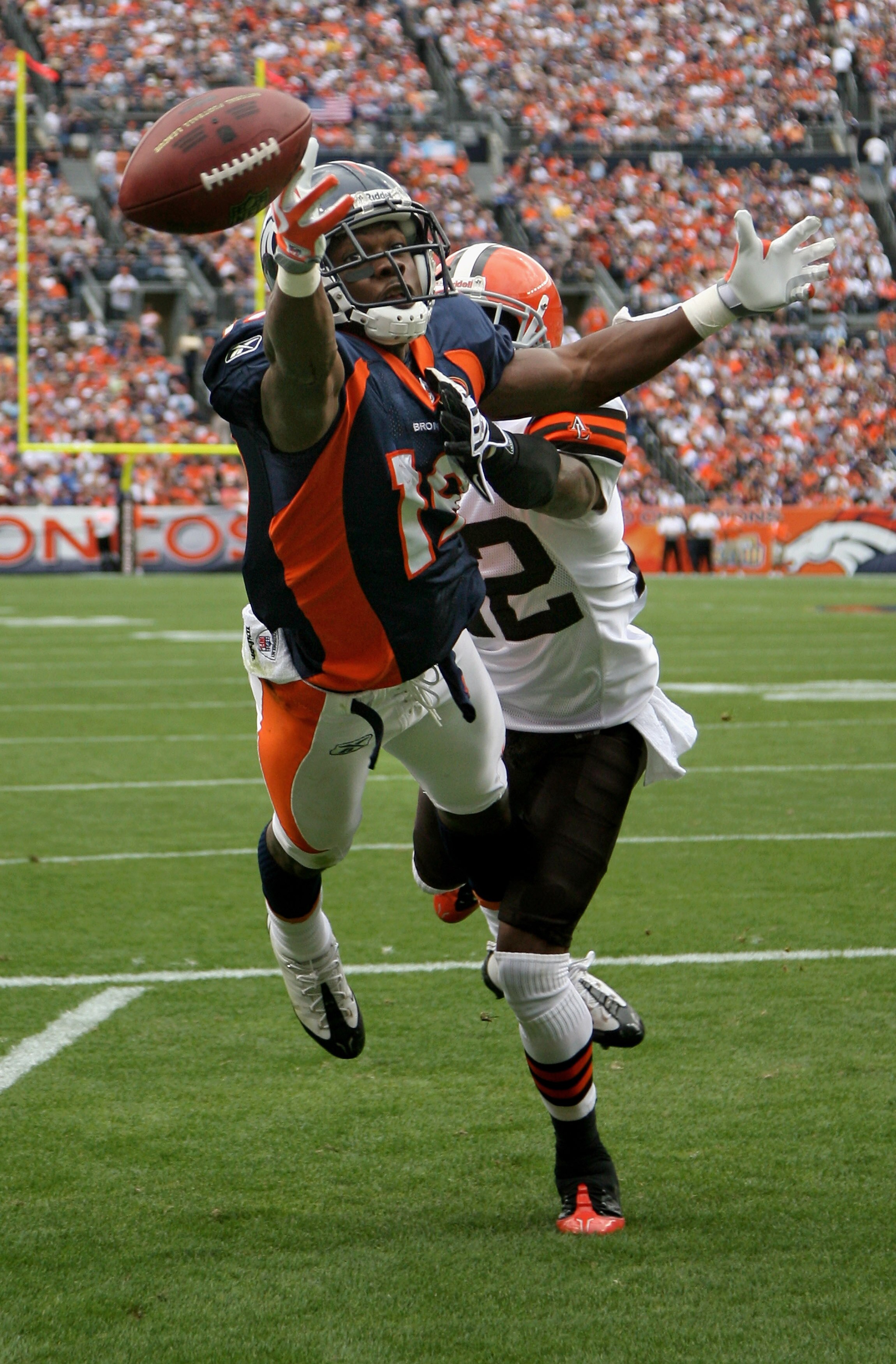 DENVER - SEPTEMBER 20:  Wide reciever Eddie Royal #19 of the Denver Broncos is unable to make a reception in the endzone as defensive back Brandon McDonald #22 of the Cleveland Browns during NFL action at Invesco Field at Mile High on September 20, 2009 i